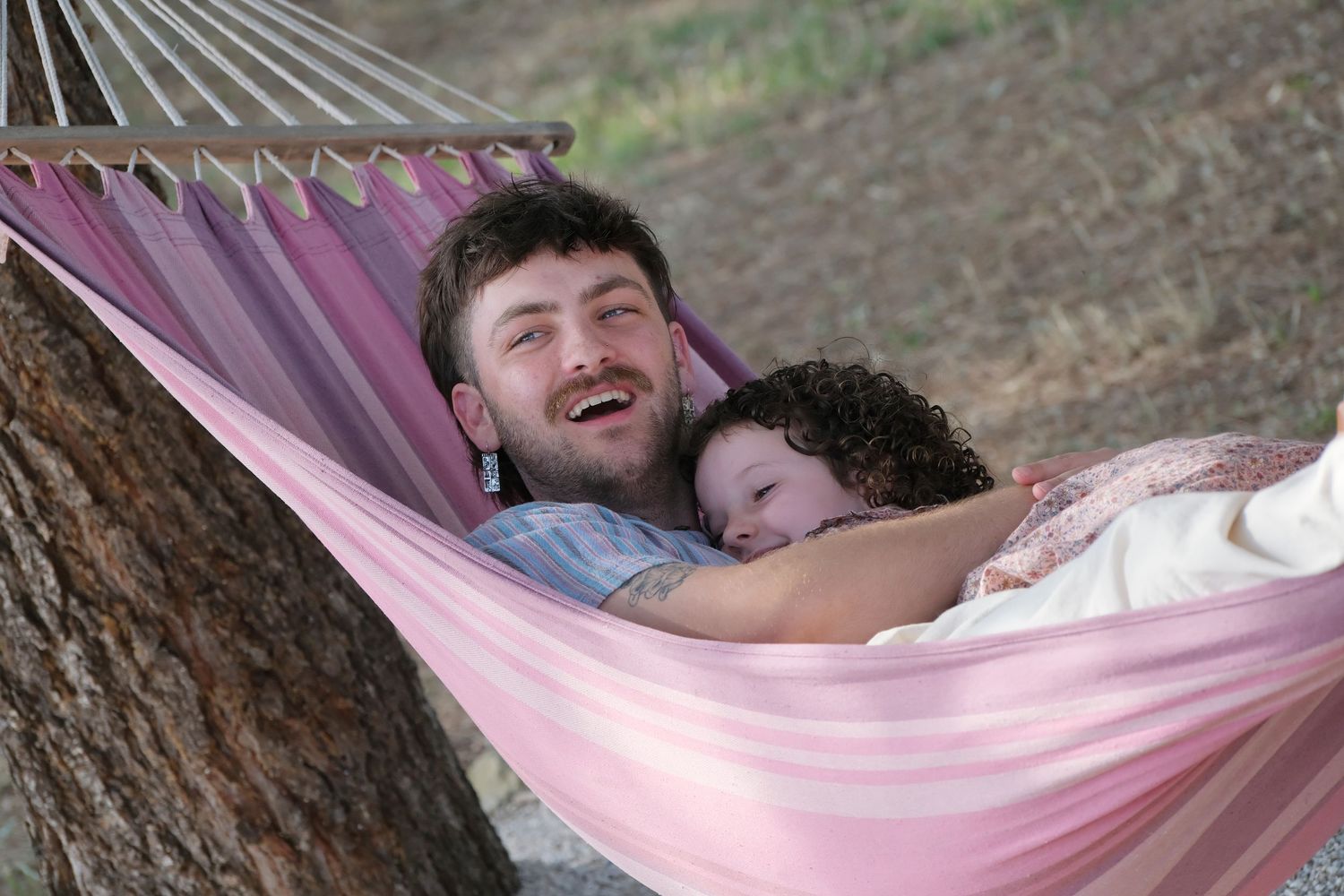 “Natural family portrait in Puglia capturing fun, joyful, and authentic moments with parents and children.”