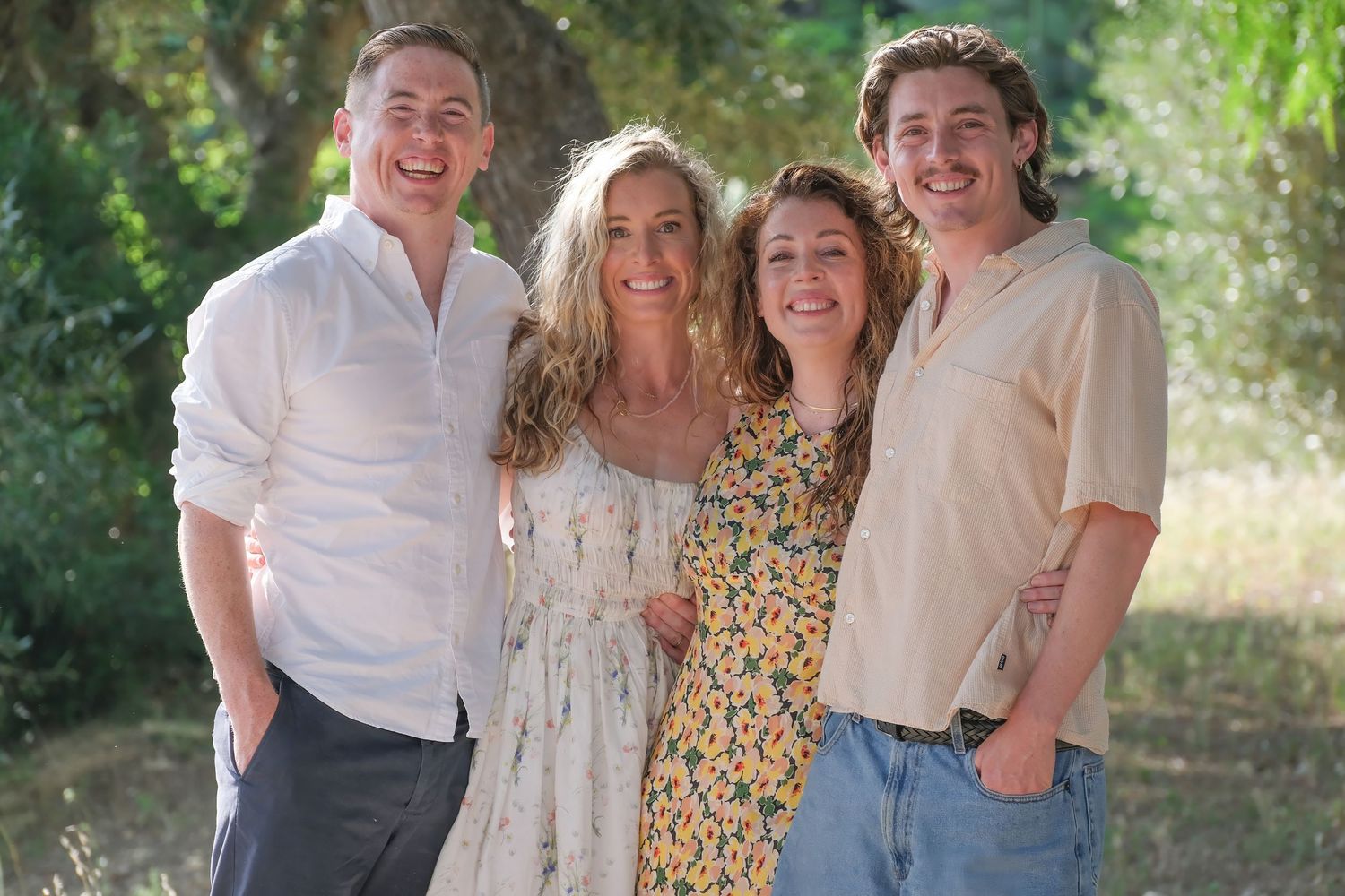 “Natural family portrait in Puglia capturing fun, joyful, and authentic moments with parents and children.”