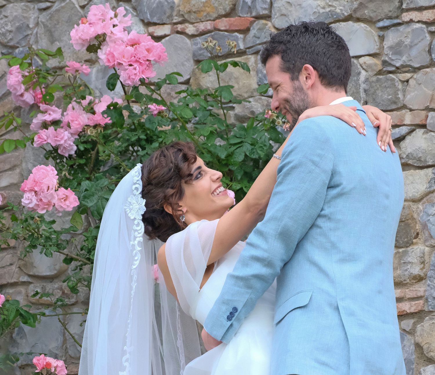 “Fun and joyful wedding photo in Italy capturing natural, playful, and loving moments of the bride and groom.”
