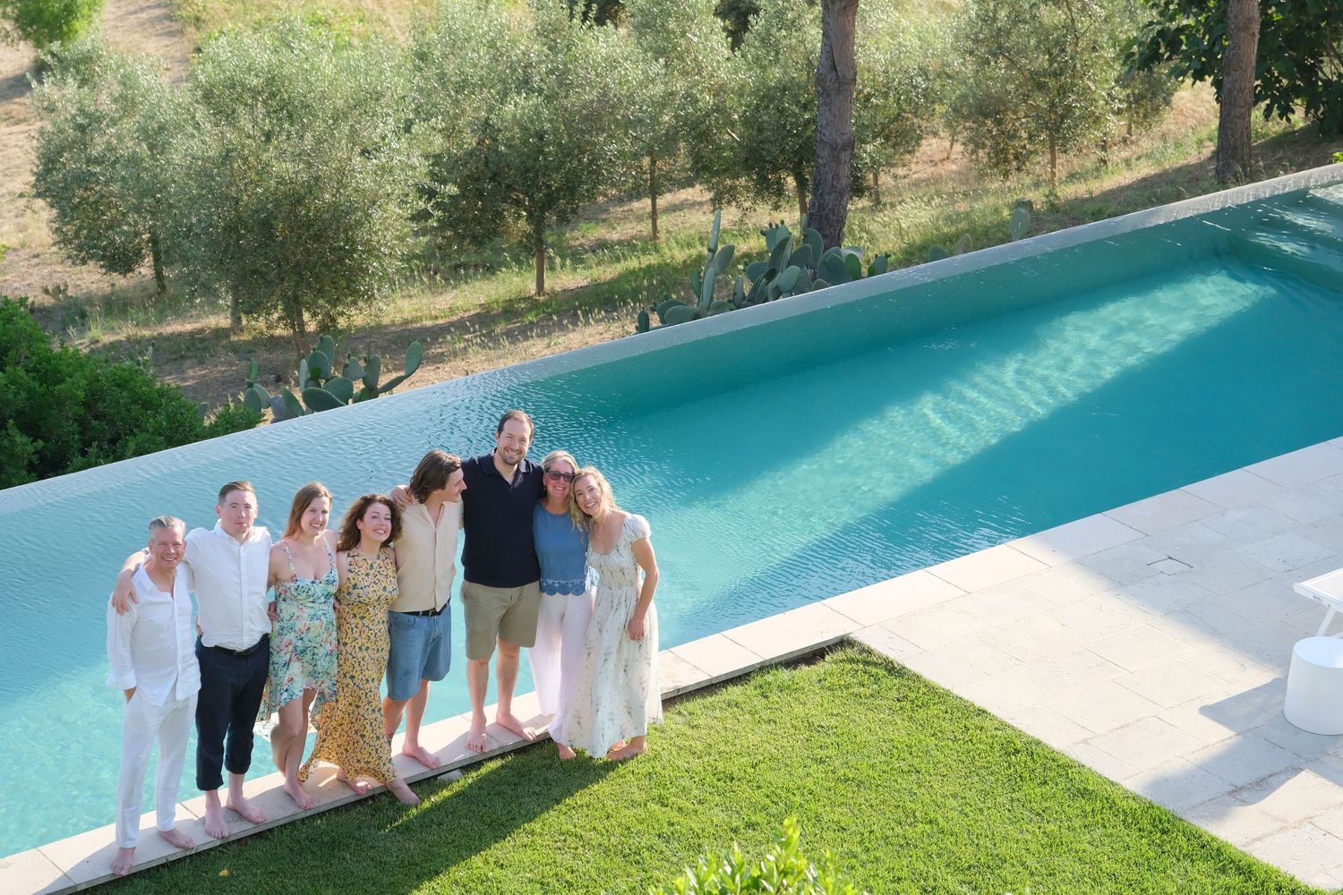“Relaxed and fun family portrait in Puglia capturing genuine smiles and playful moments.”