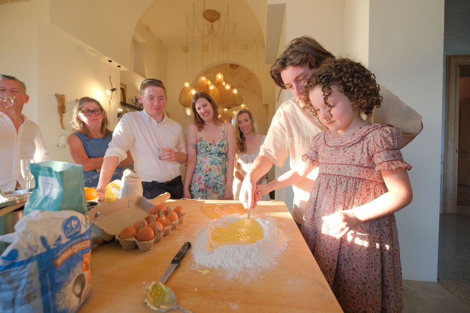 “Natural family portrait in Puglia capturing fun, joyful, and authentic moments with parents and children.”