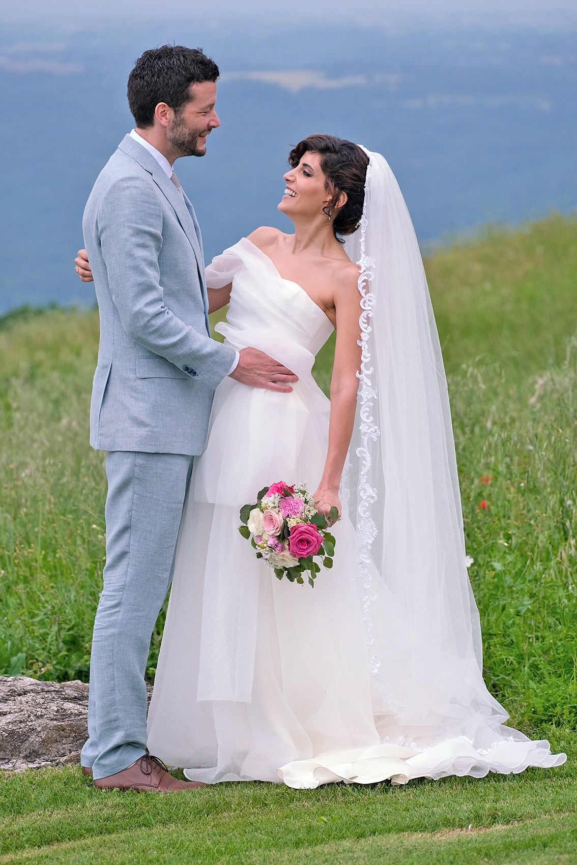 “Fun and joyful wedding photo in Italy capturing natural, playful, and loving moments of the bride and groom.”