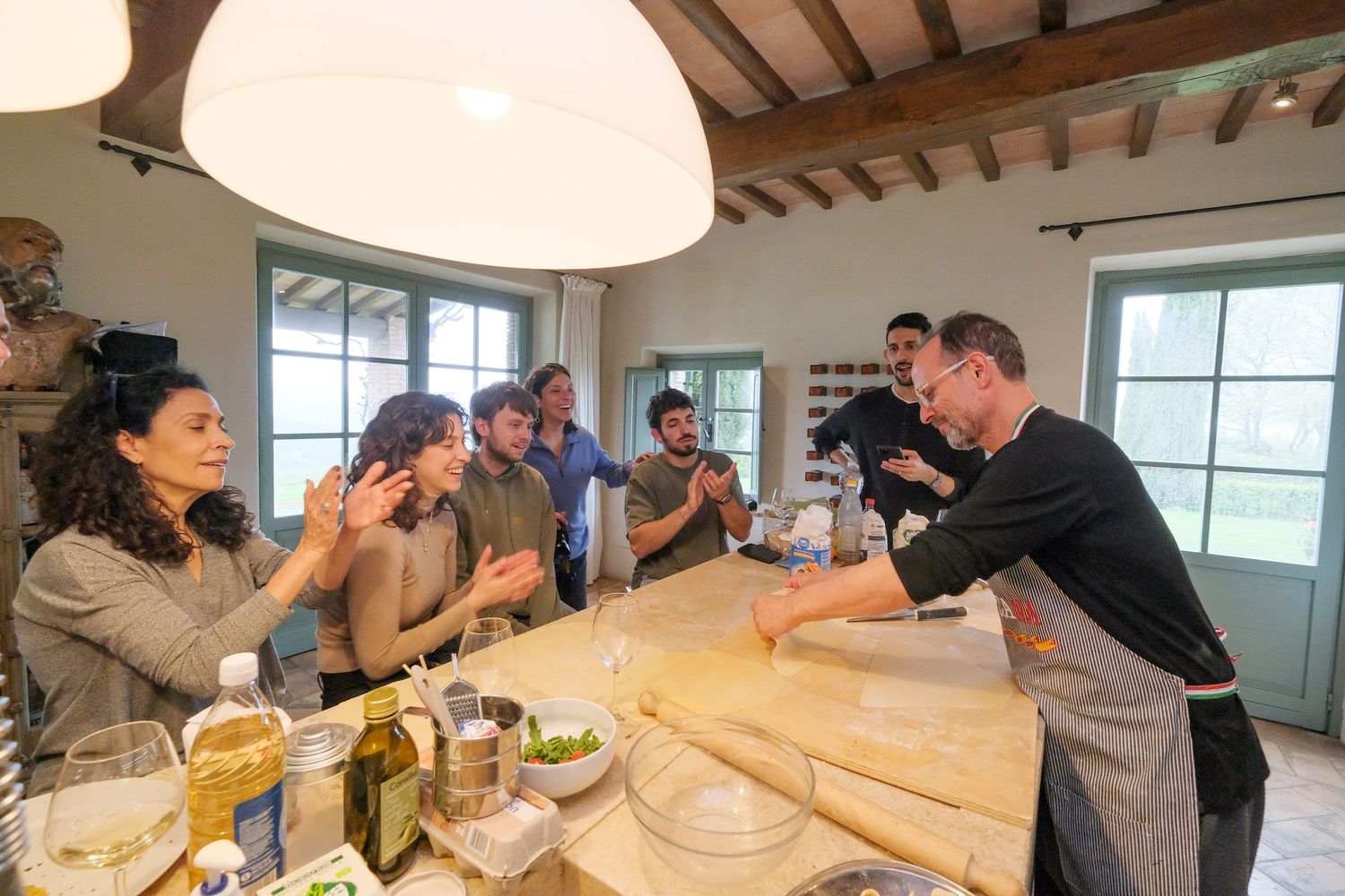 “Fun and relaxed family portrait in Italy with kids and parents enjoying authentic Cooking Class in Umbria and Tuscany.”