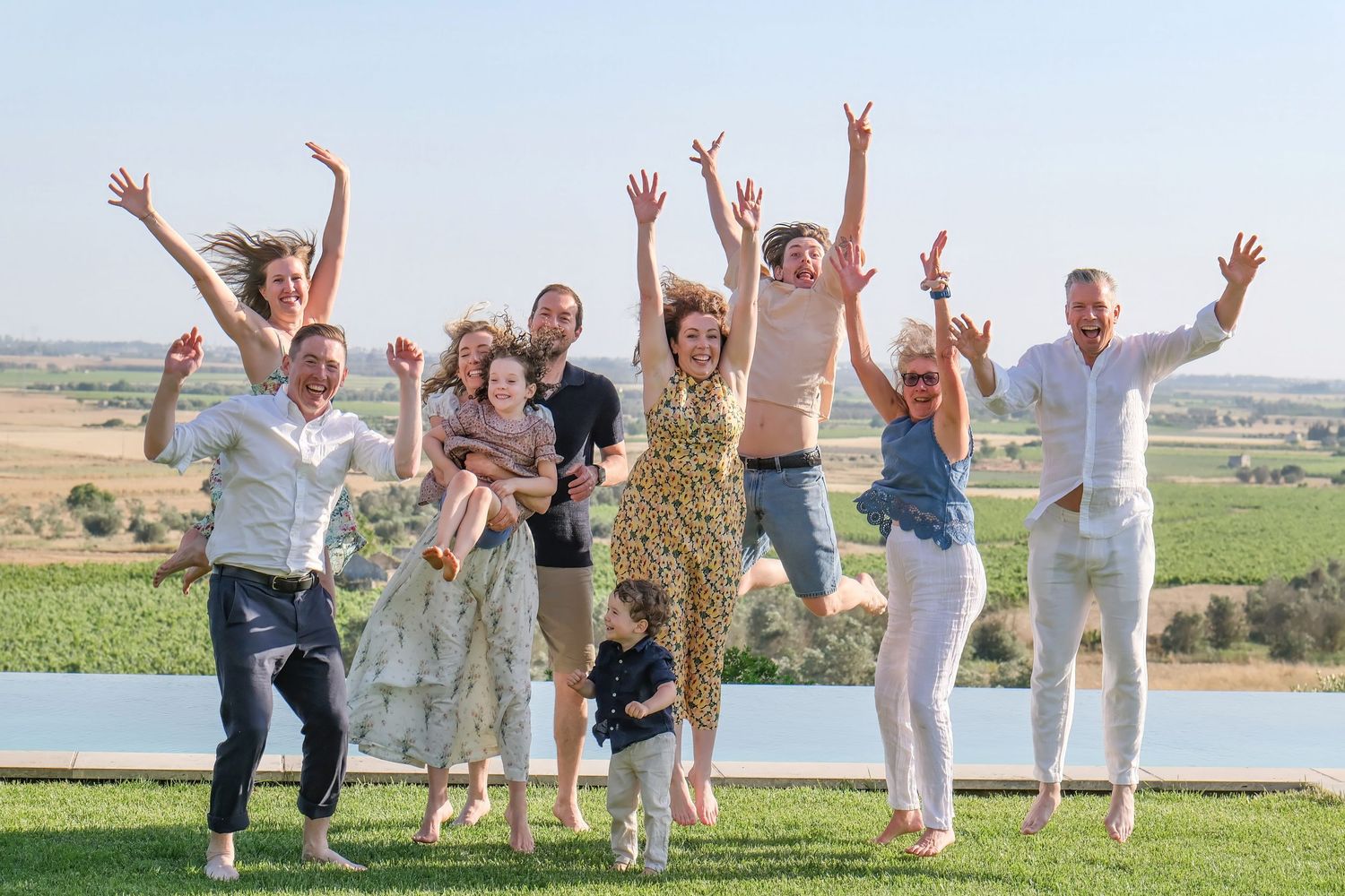 “Natural family portrait in Puglia capturing fun, joyful, and authentic moments with parents and children.”