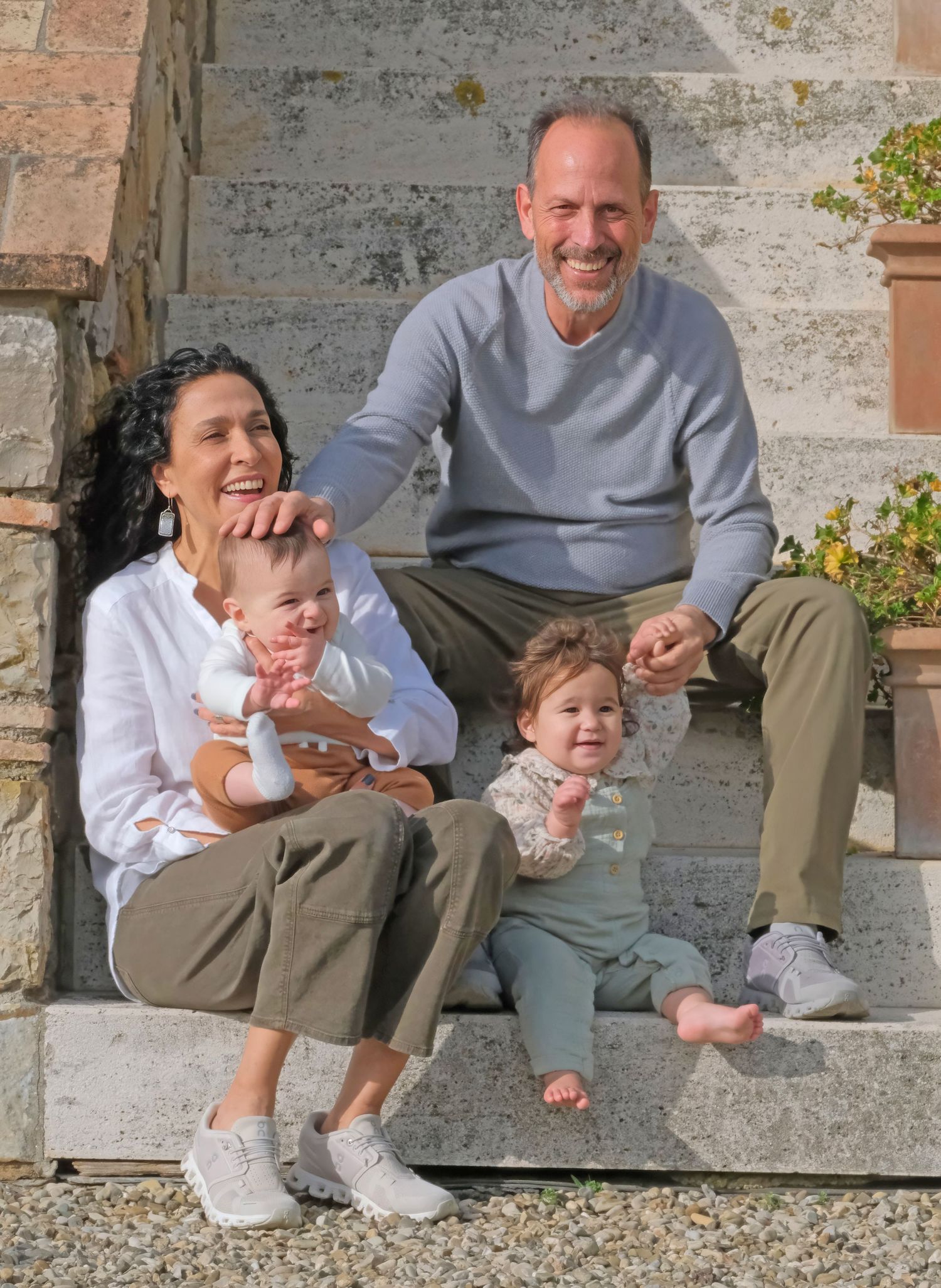 “Fun and relaxed family portrait in Italy with kids and parents enjoying authentic moments in Umbria and Tuscany.”