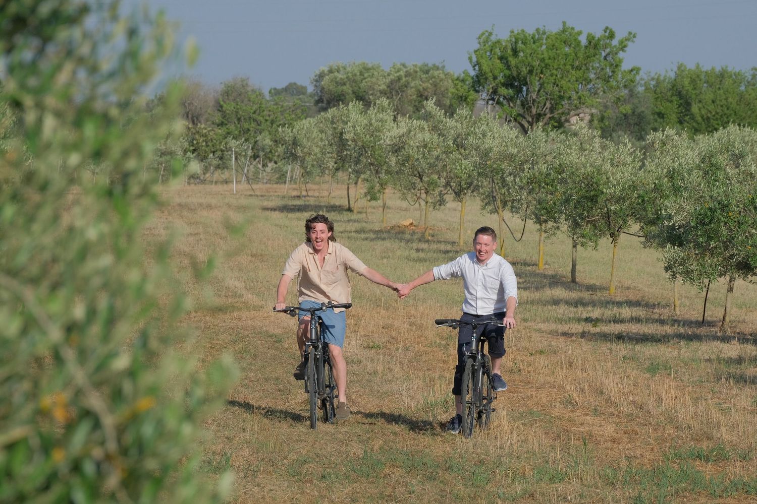 “Relaxed family portrait in Puglia enjoying fun, natural, and lively moments with children and parents.”