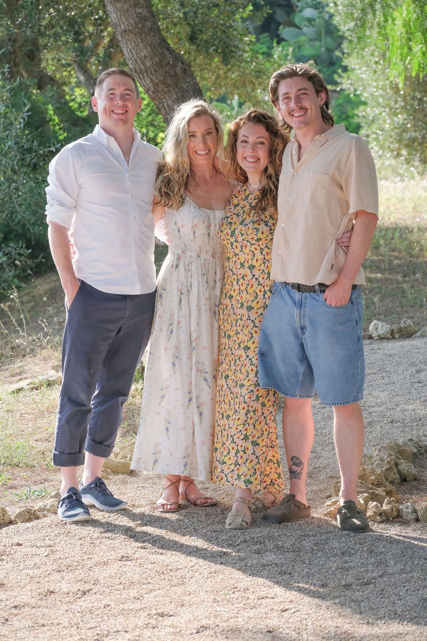 “Relaxed family portrait in Puglia enjoying fun, natural, and lively moments with children and parents.”