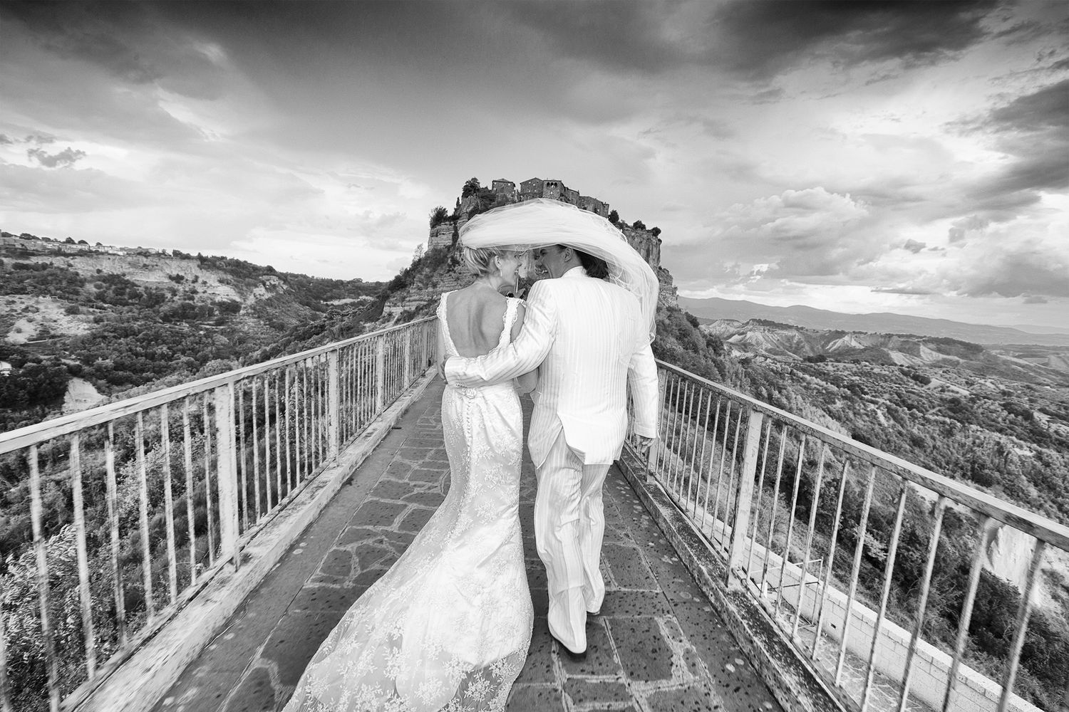 “Fun and joyful wedding photo in Italy capturing natural, playful, and loving moments of the bride and groom.”