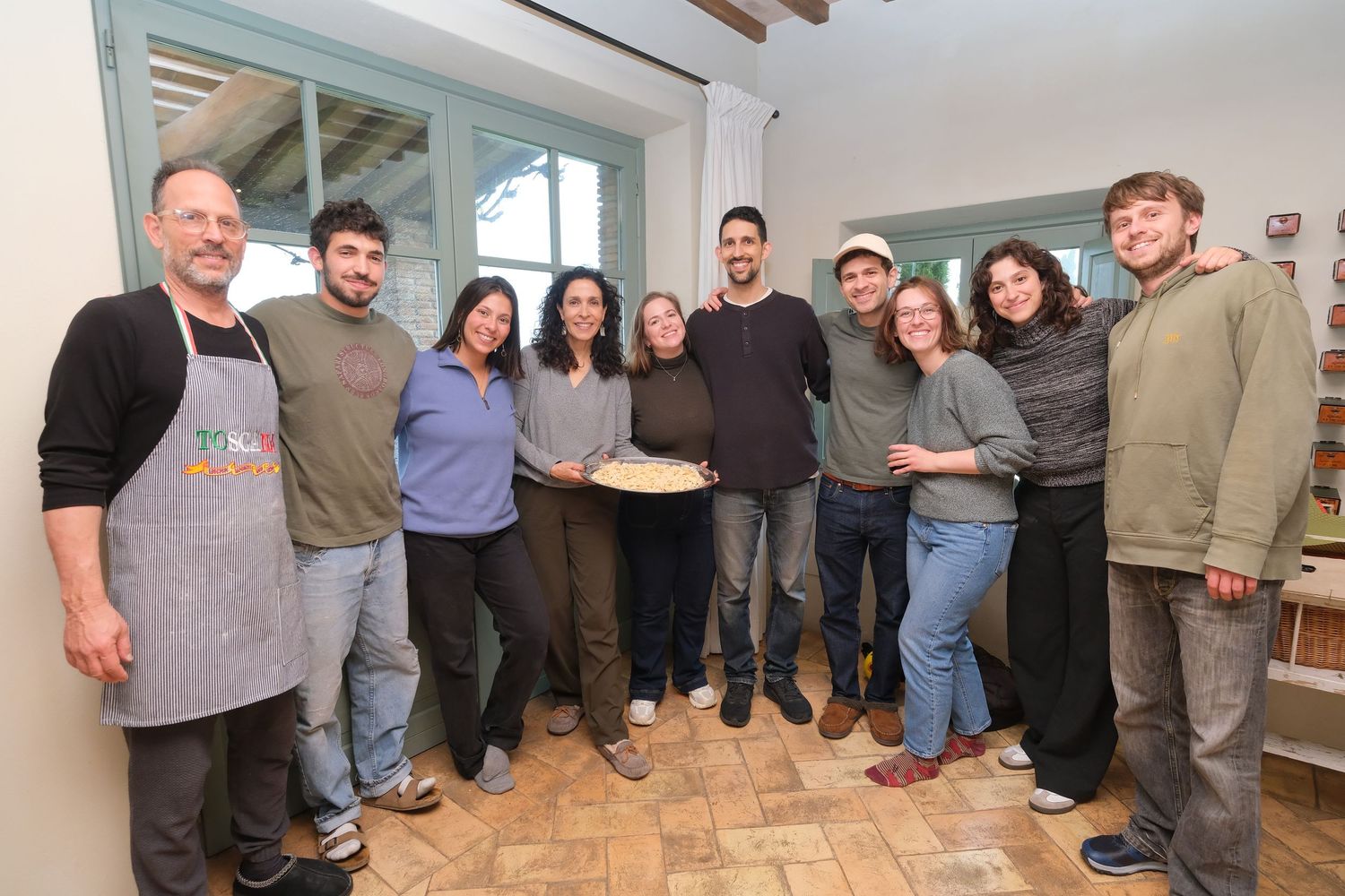 “Fun and relaxed family portrait in Italy with kids and parents enjoying authentic Cooking Class in Umbria and Tuscany.”