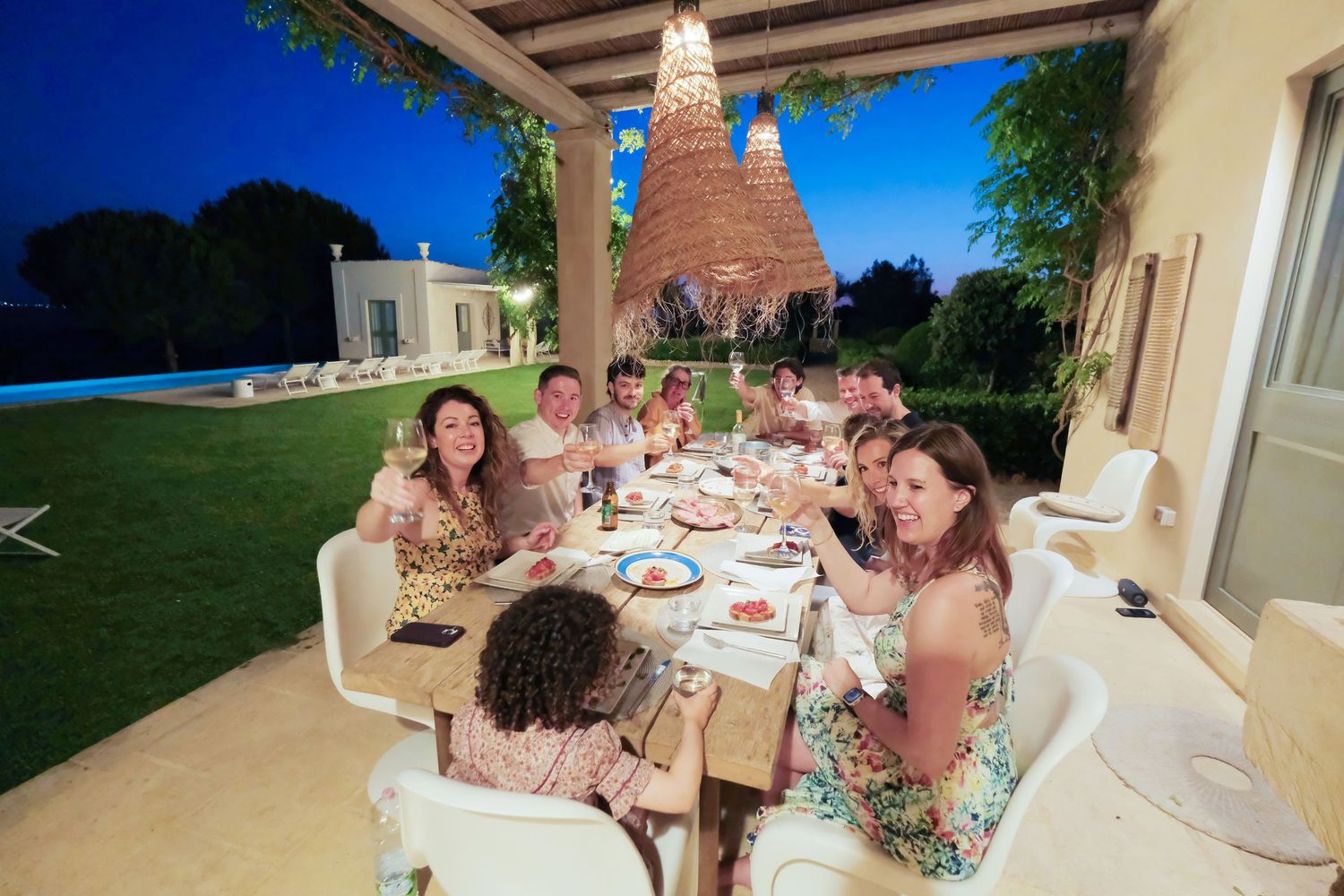 “Natural family portrait in Puglia capturing fun, joyful, and authentic moments with parents and children.”