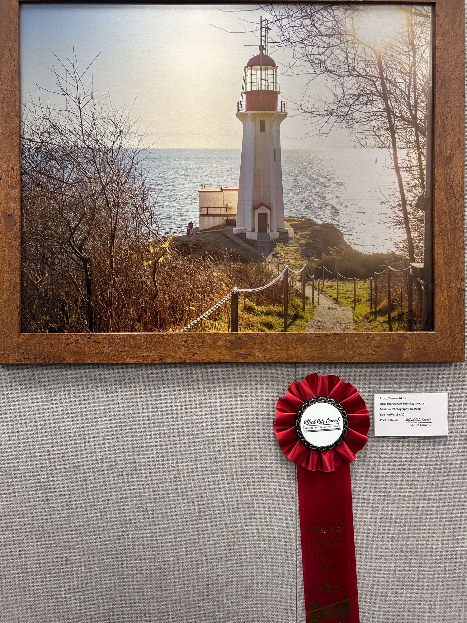 Award-winning framed photograph of Sheringham Point Lighthouse displayed with a red second-place ribbon.