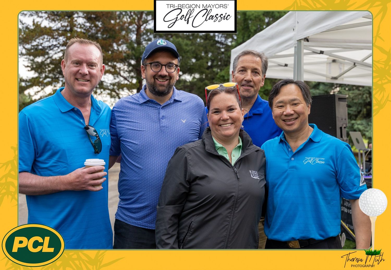 Five smiling professionals pose together at a PCL Golf Classic charity event outdoors under a white tent.