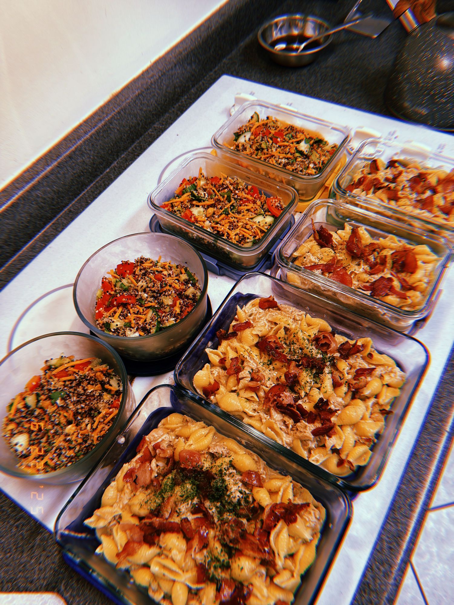 A progression of dishes showing pasta with roasted vegetables and garnishes being plated and served in multiple portions.
