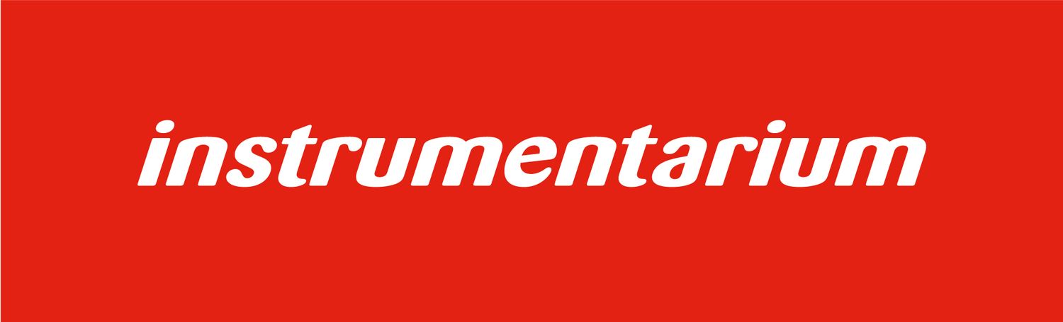 Red banner with white text displaying the word 'instrumentarium' in lowercase letters.