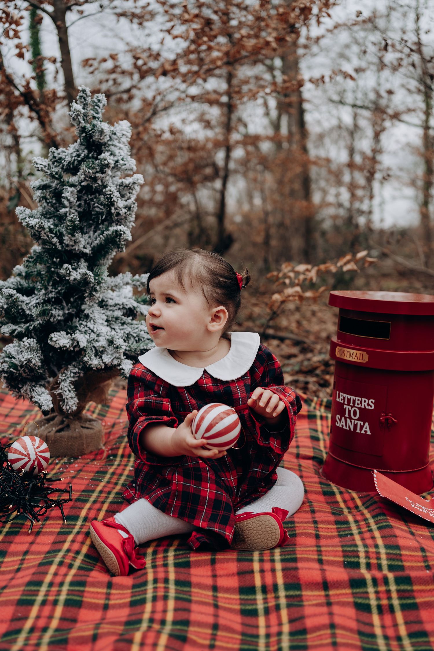 Three holiday photos show a plaid blanket with small Christmas trees and red gift boxes arranged for festive decoration.
