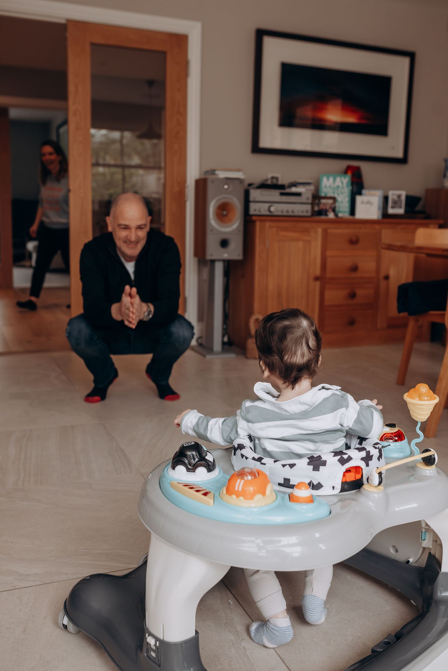 Activity table with toys and decorative items in home setting.