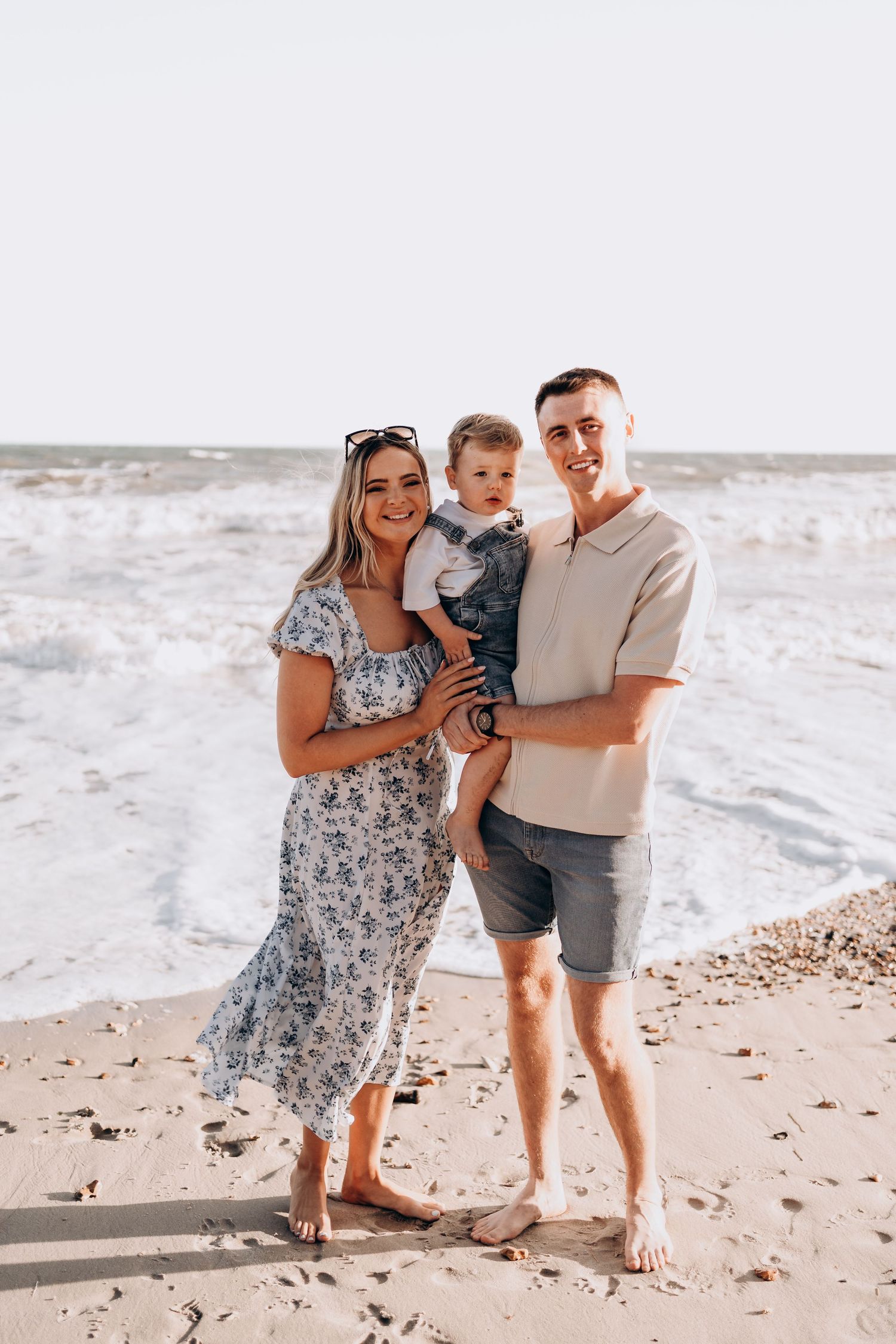 Happy family moment captured on a bright sandy beach.