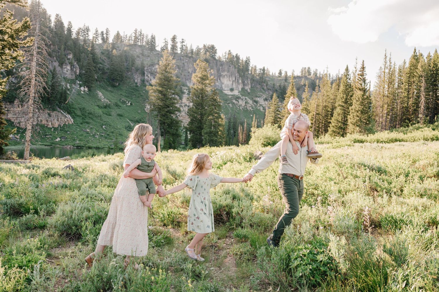 A joyful scene in a mountain meadow with evergreen trees and wildflowers as a backdrop.