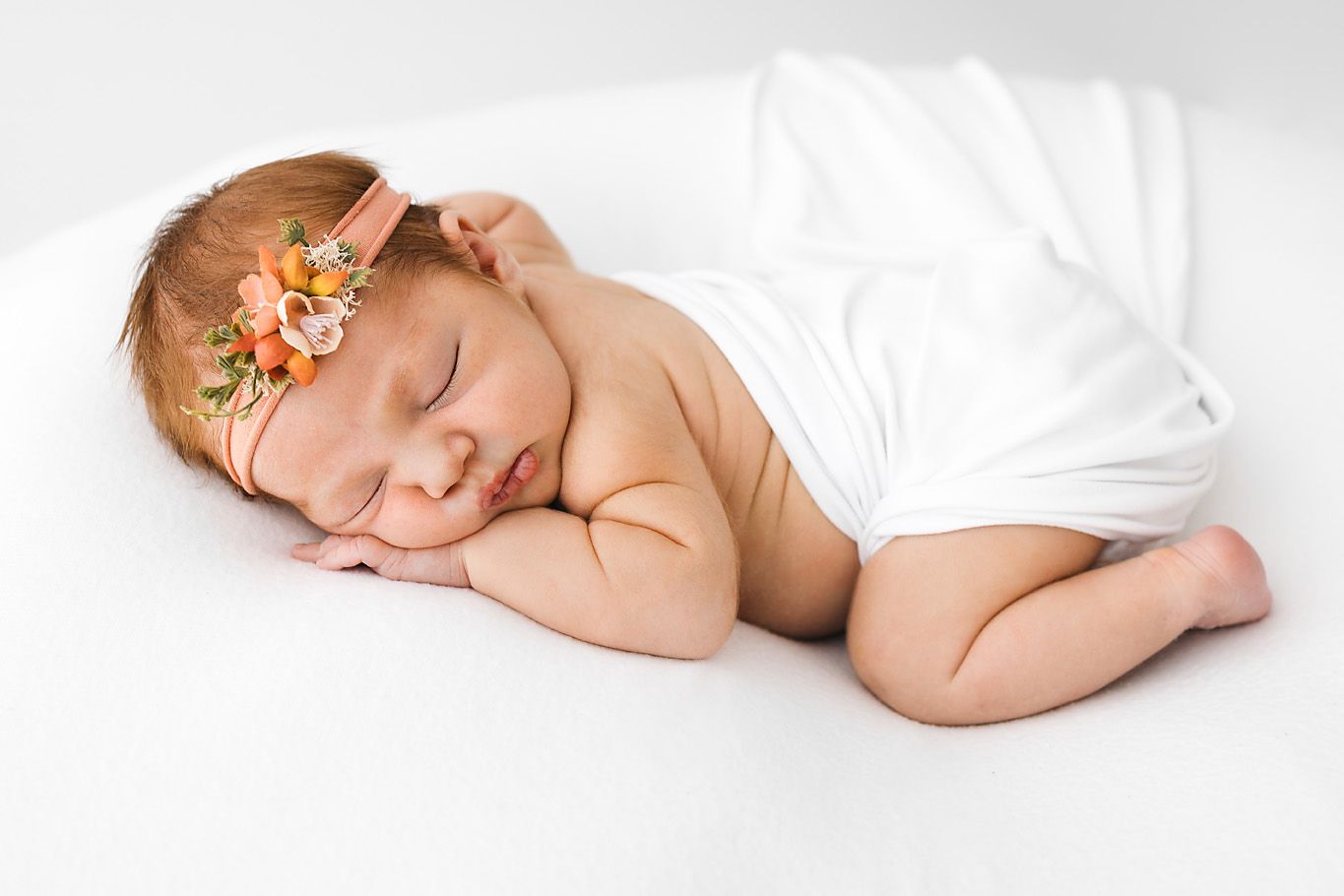 Photo of newborn baby laying down squishy. Newborn photographer taking photos in Santa Fe. Kids and children photographe