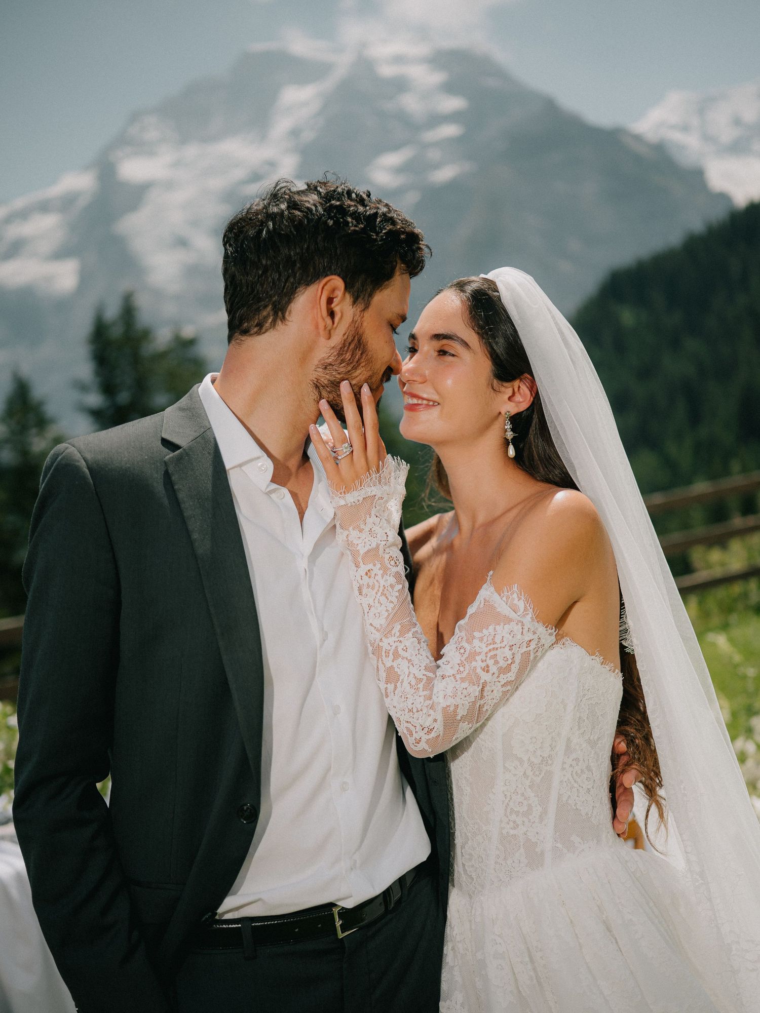 Romantic wedding couple shares intimate moments in a series of photos with mountain scenery in the background.
