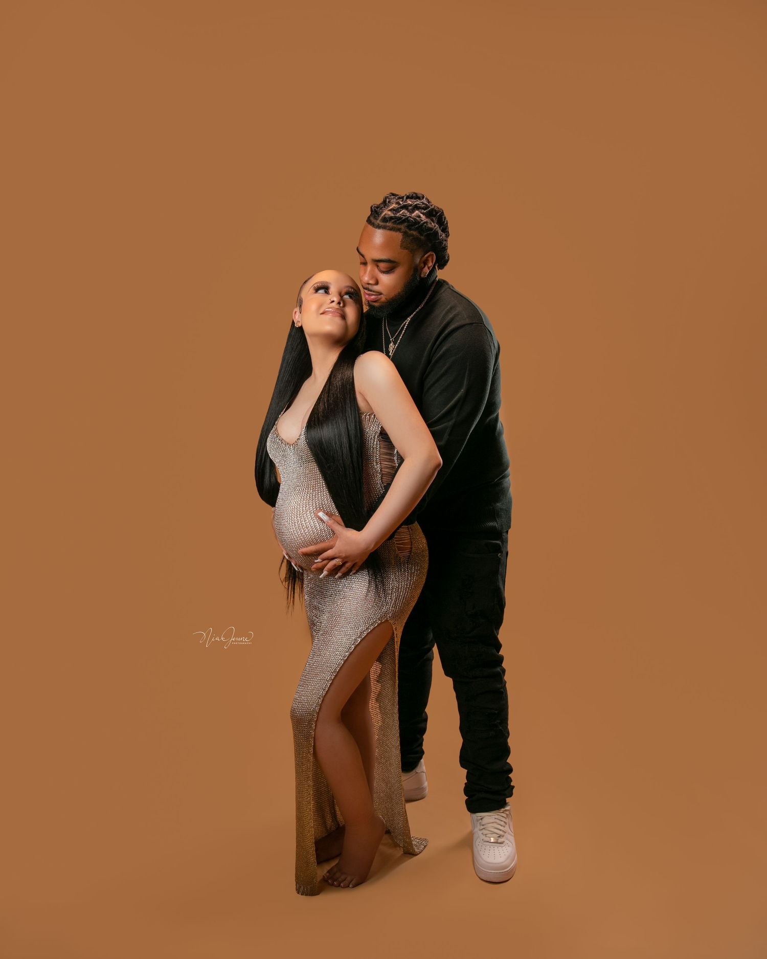 Intimate couples photography session with neutral tones and dramatic poses.