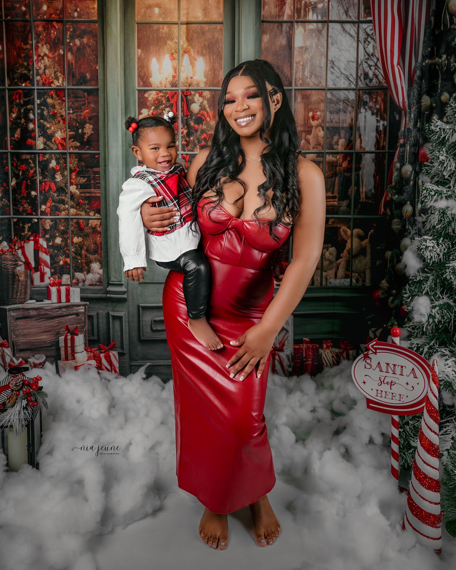 Christmas themed family photos with fog effect and festive decorations.