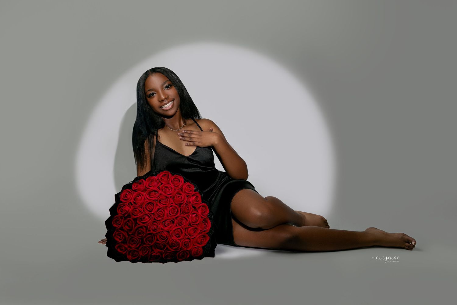A series of artistic boudoir photos featuring red roses and dramatic lighting against dark backgrounds.