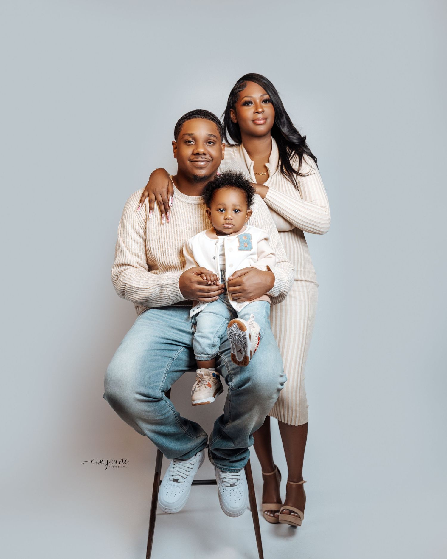 Progressive photos showing a parent and child in light-colored outfits against grey background.