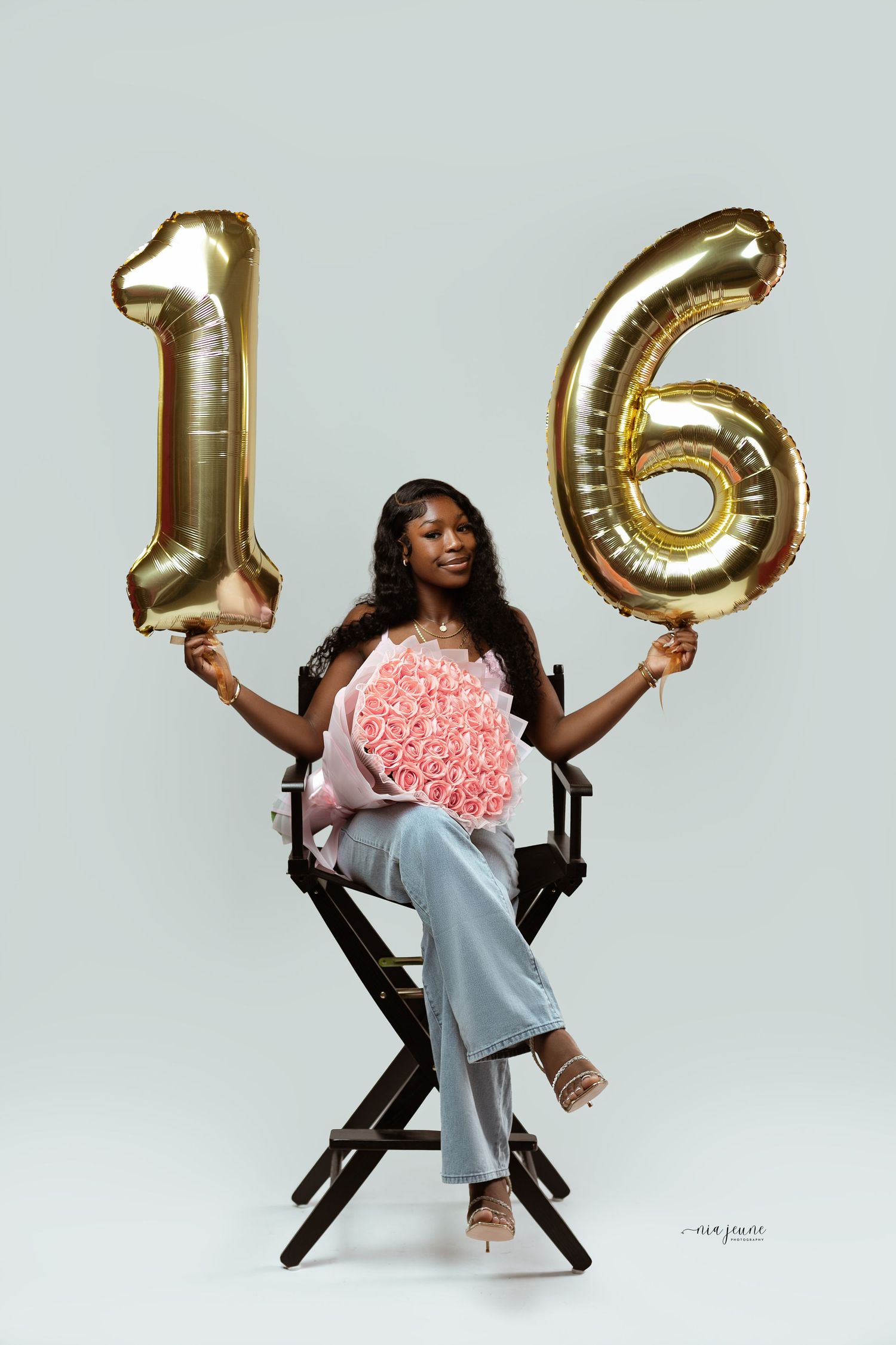 A series of photos showing someone posing in a director's chair with gold number balloons and pink flowers.