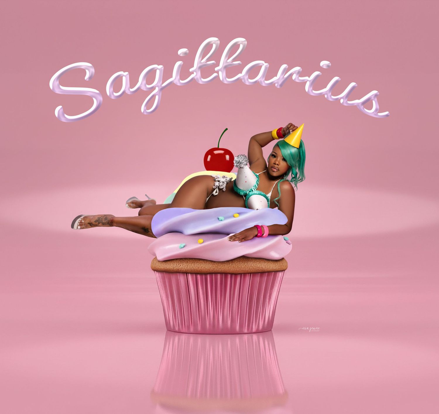 Artistic cupcake illustration featuring a zodiac Sagittarius theme with pink frosting and decorative elements on pink background.