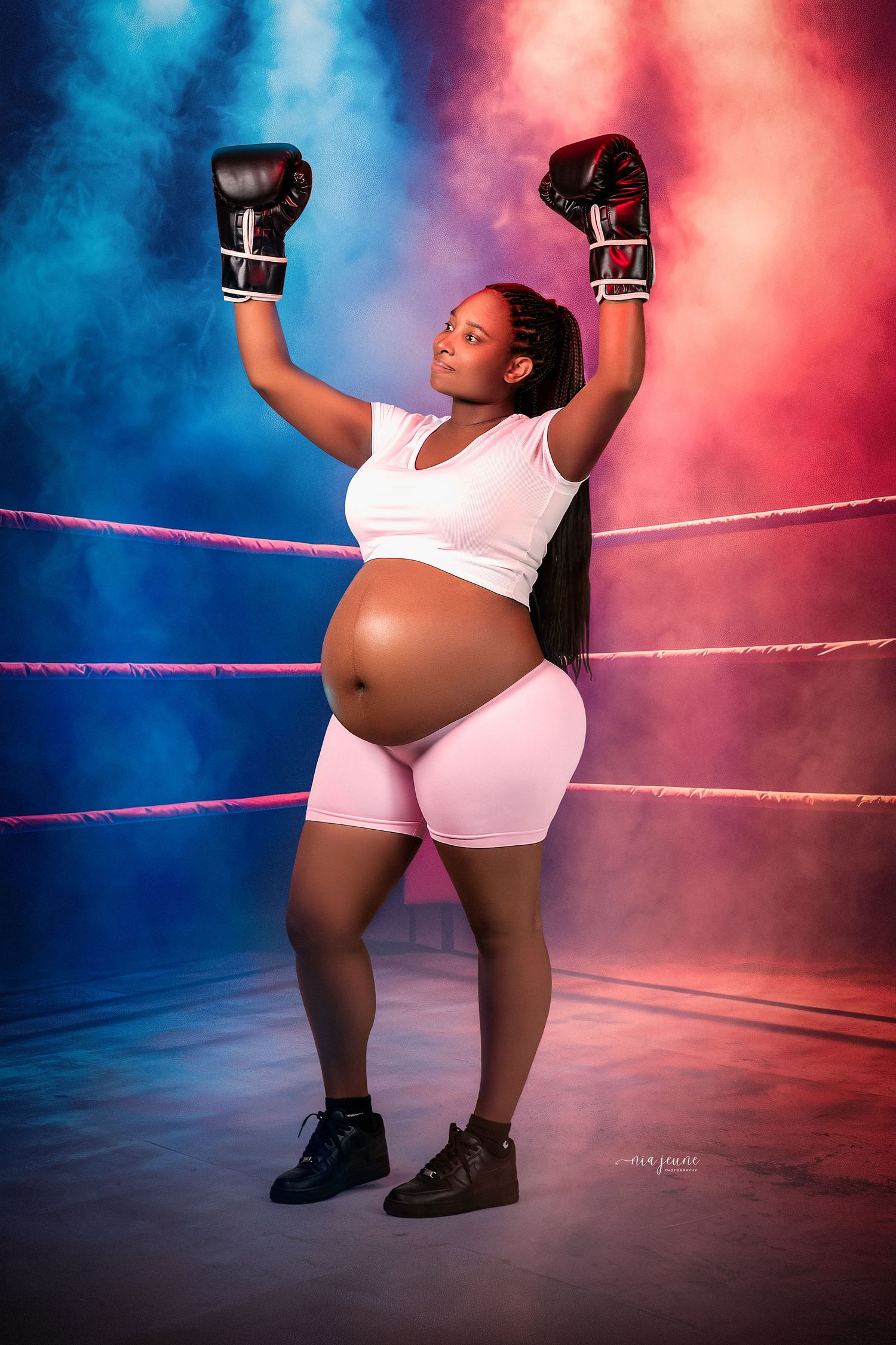 Dramatic sports photography series showing a boxer's powerful poses against blue and red lighting in a boxing ring.