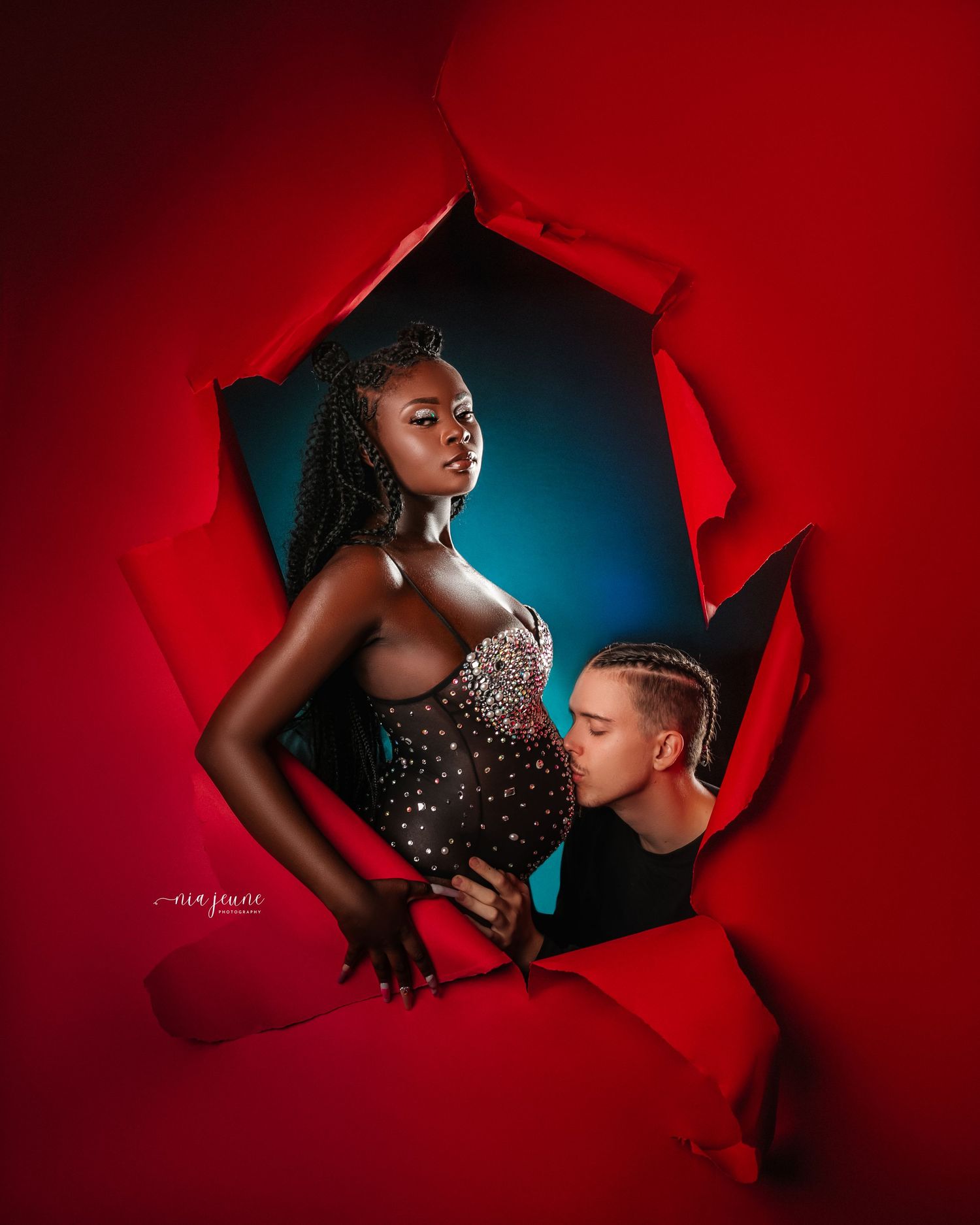 Creative portrait series with dramatic red lighting and paper tear effect.