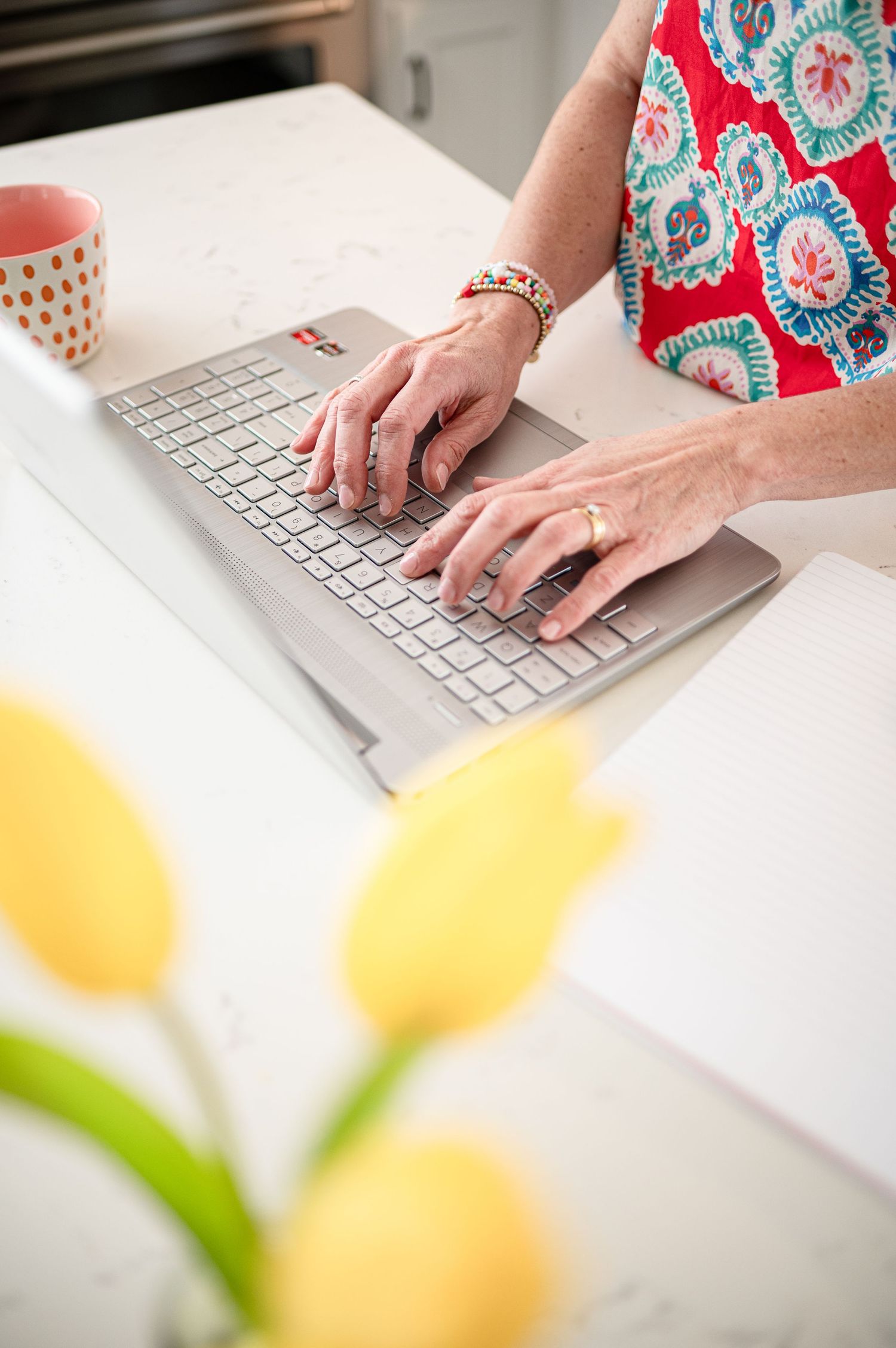 woman typing on laptop