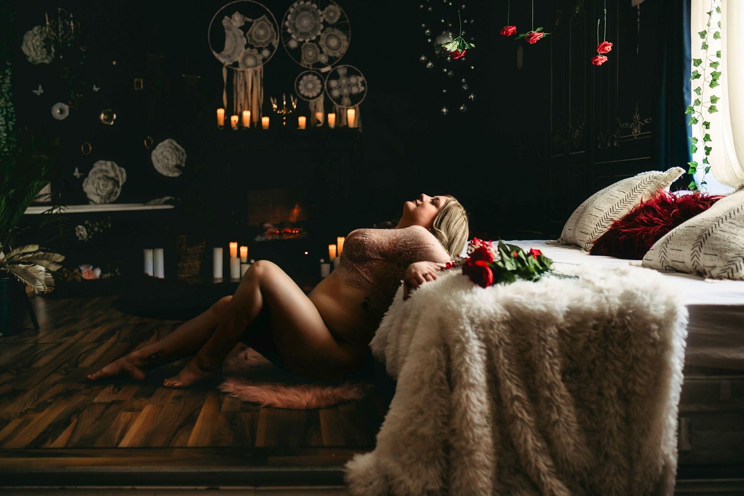 Sensual woman reclining in dark moody bedroom, soft lighting highlighting curves, relaxed and surrendered pose amid intimate shadows