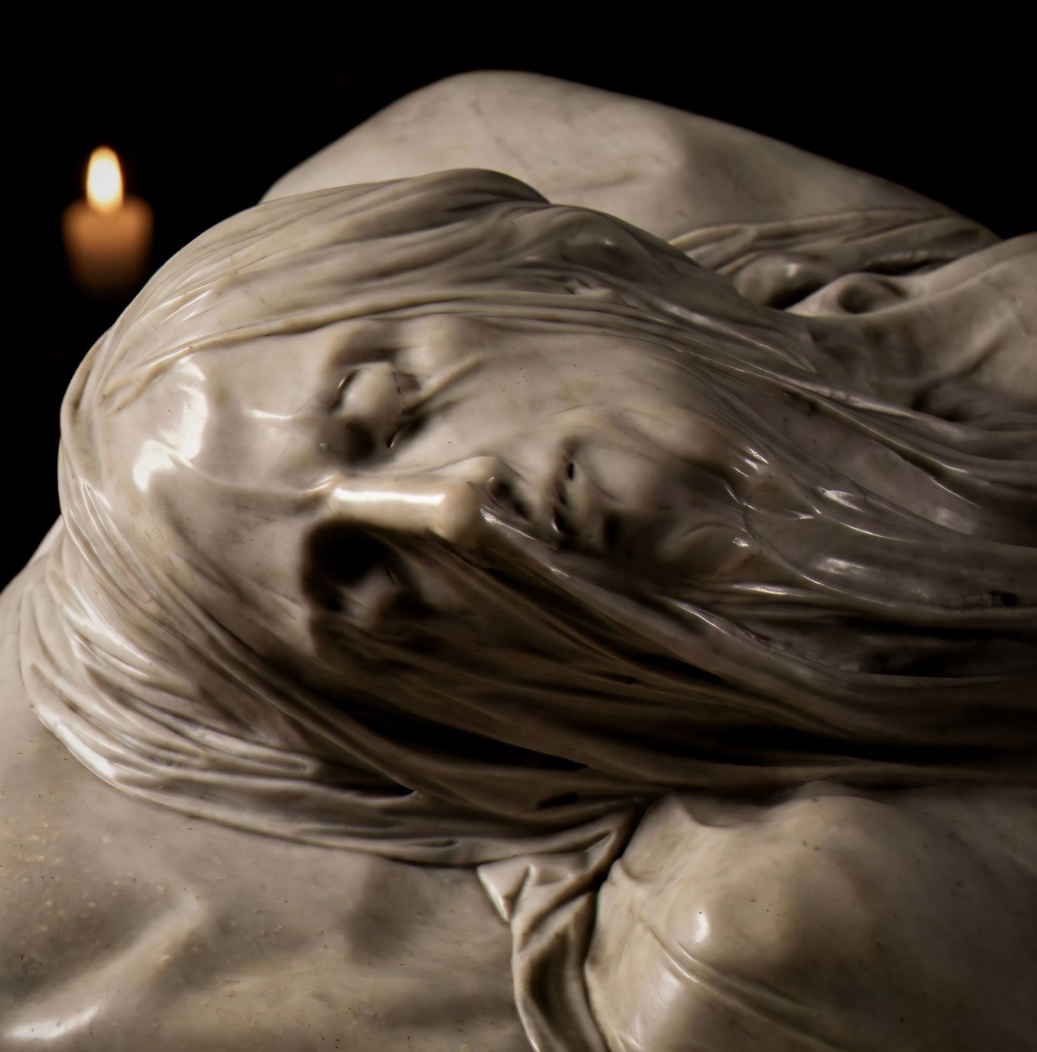 Detailed close-up sequence showing different angles of a carved marble sculpture with flowing drapery and intricate details.
