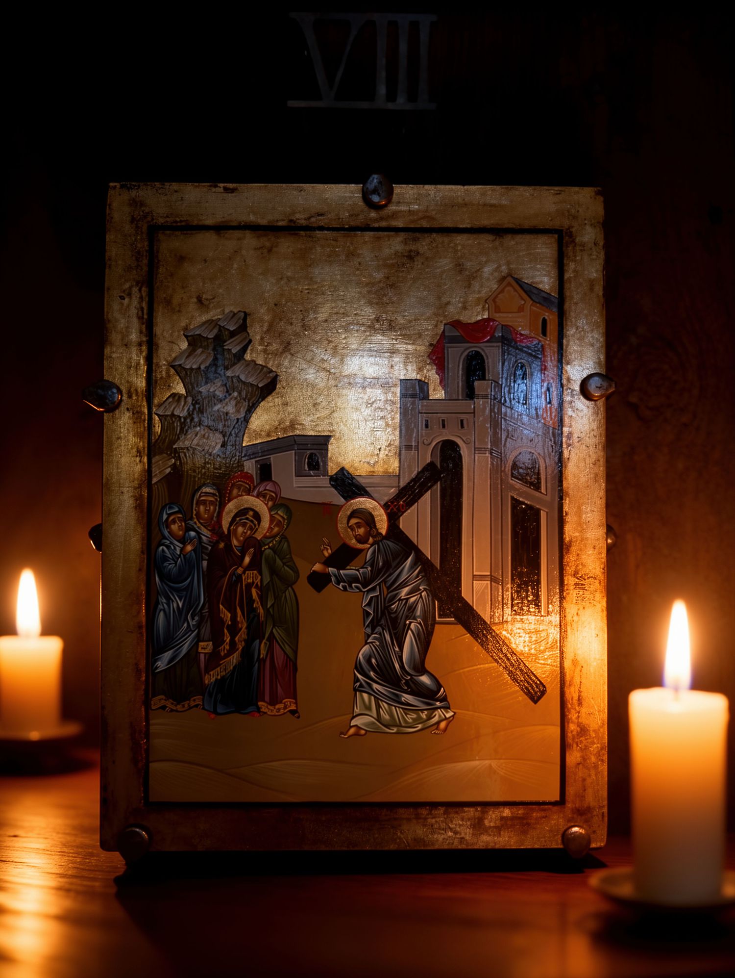 Byzantine icon of Jesus carrying the cross illuminated by candlelight, Station VII of the Cross.