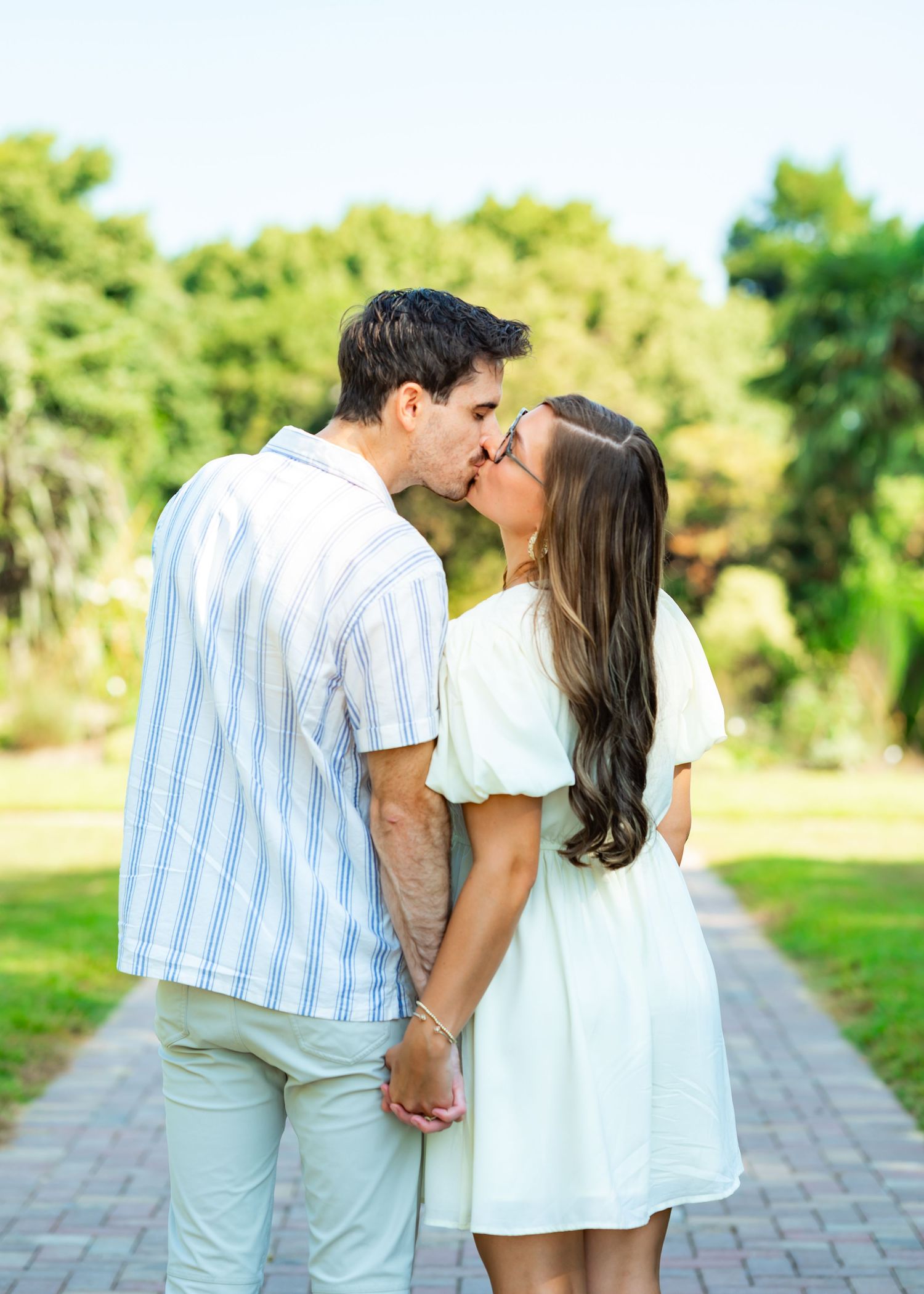 Couple posing together during a Raleigh NC engagement photoshoot