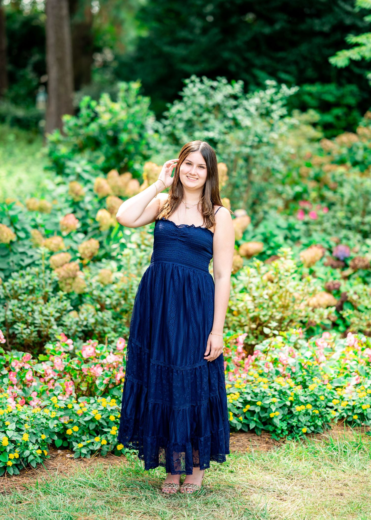 Graduate celebrating in Raleigh NC portrait session
