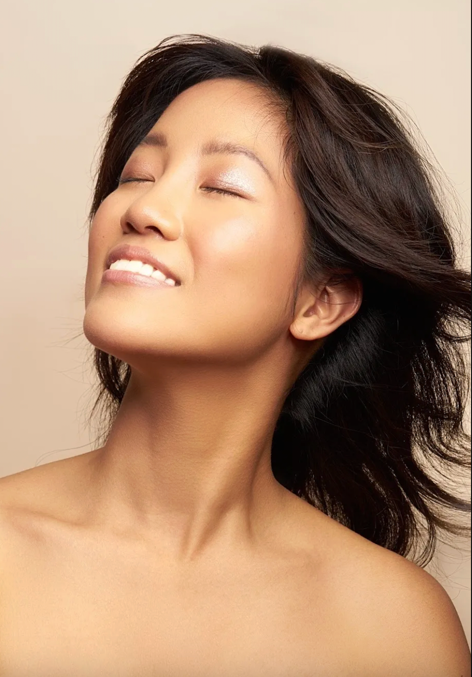 Artistic beauty shots showcasing natural makeup and dark hair against beige backdrop.
