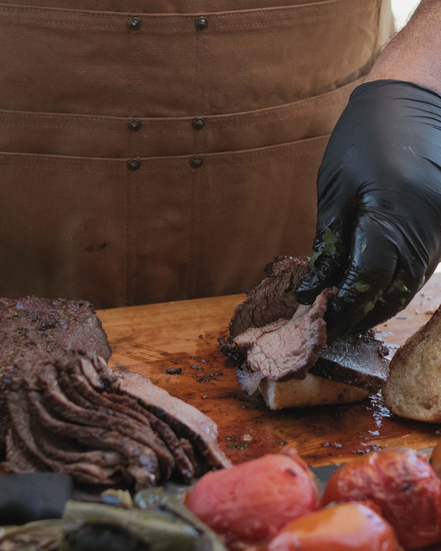 chef builds a tri-tip sandwich