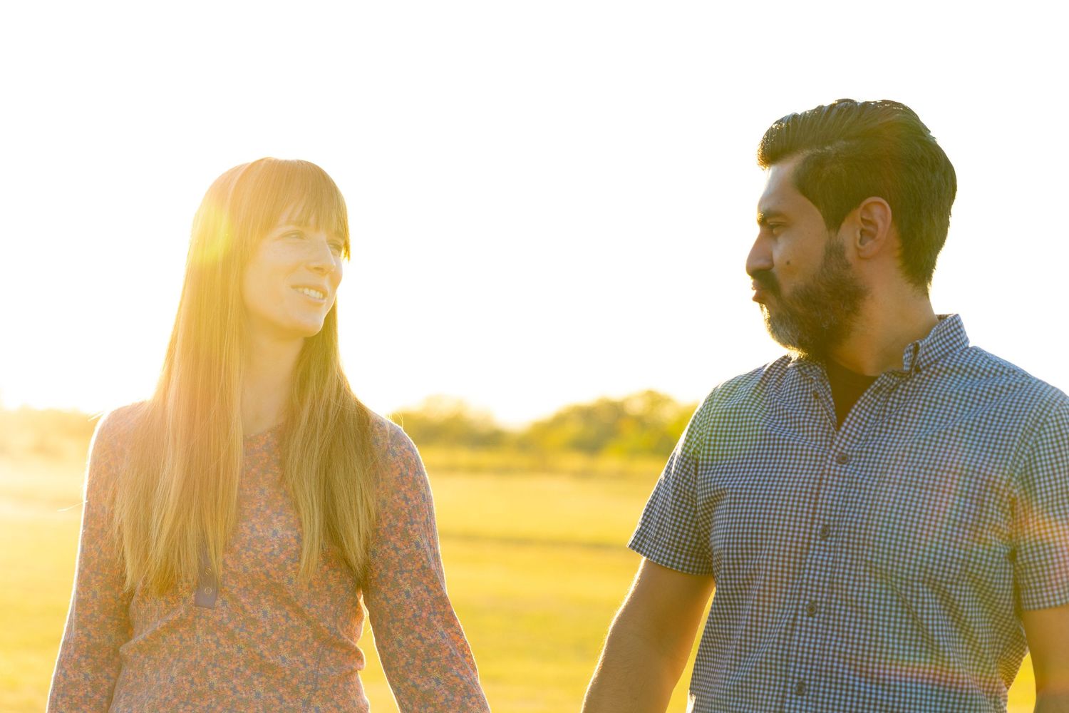 outdoor family portrait group smiling at sunset with natural light candid moments married