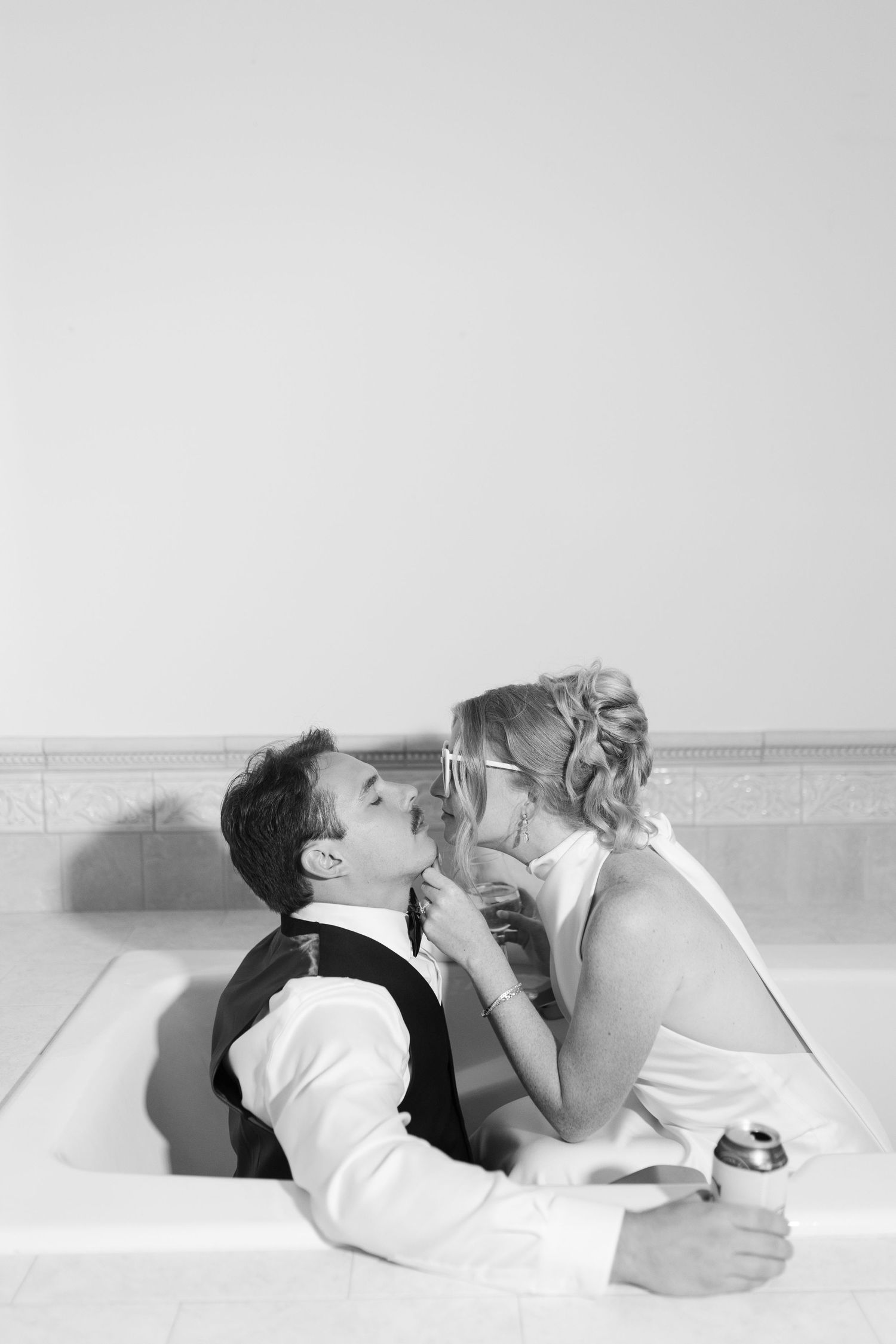 Couple lying together in intimate black and white portrait series.