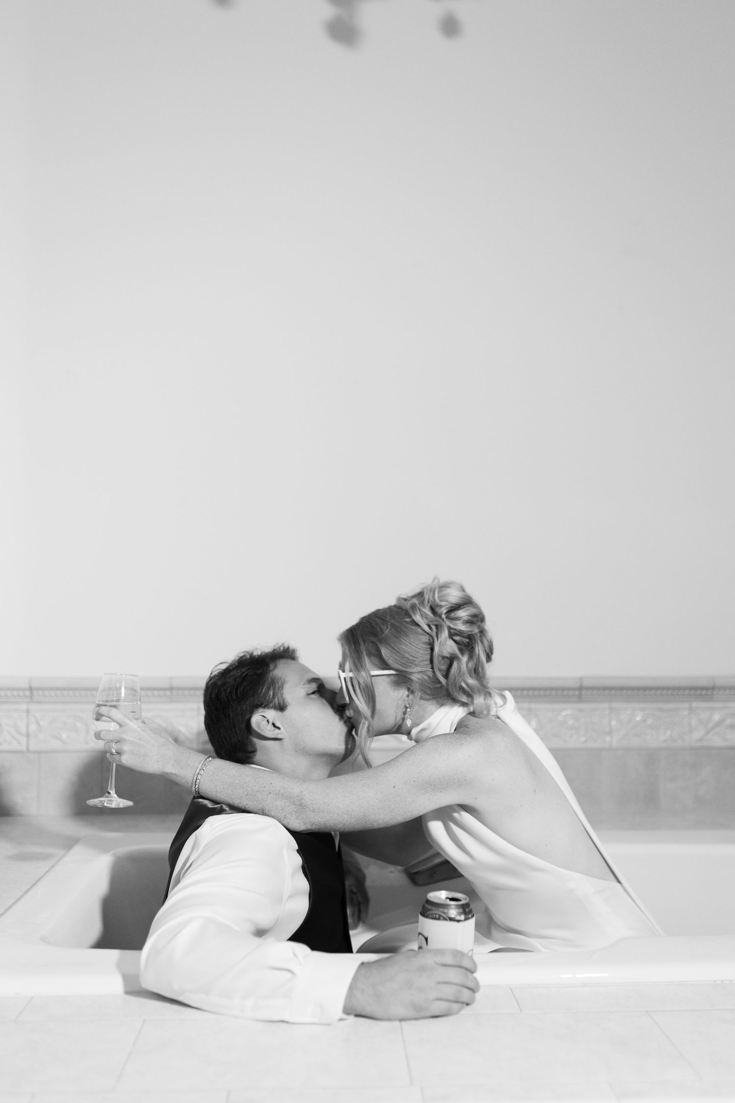 Black and white artistic photo series of a couple lying down together.