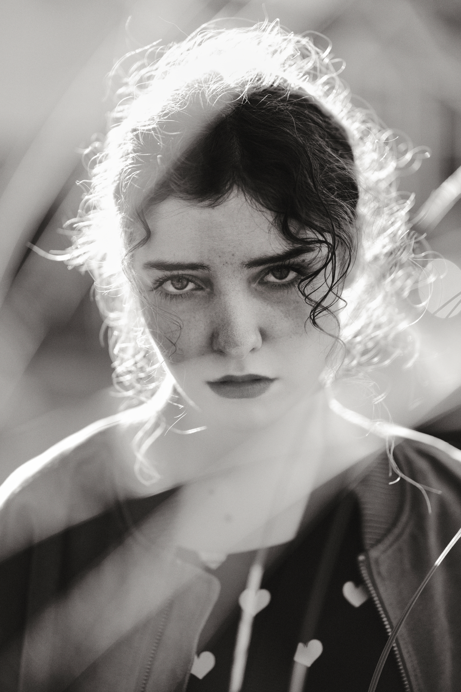 Dramatic black and white portraits with backlit hair creating an ethereal effect.