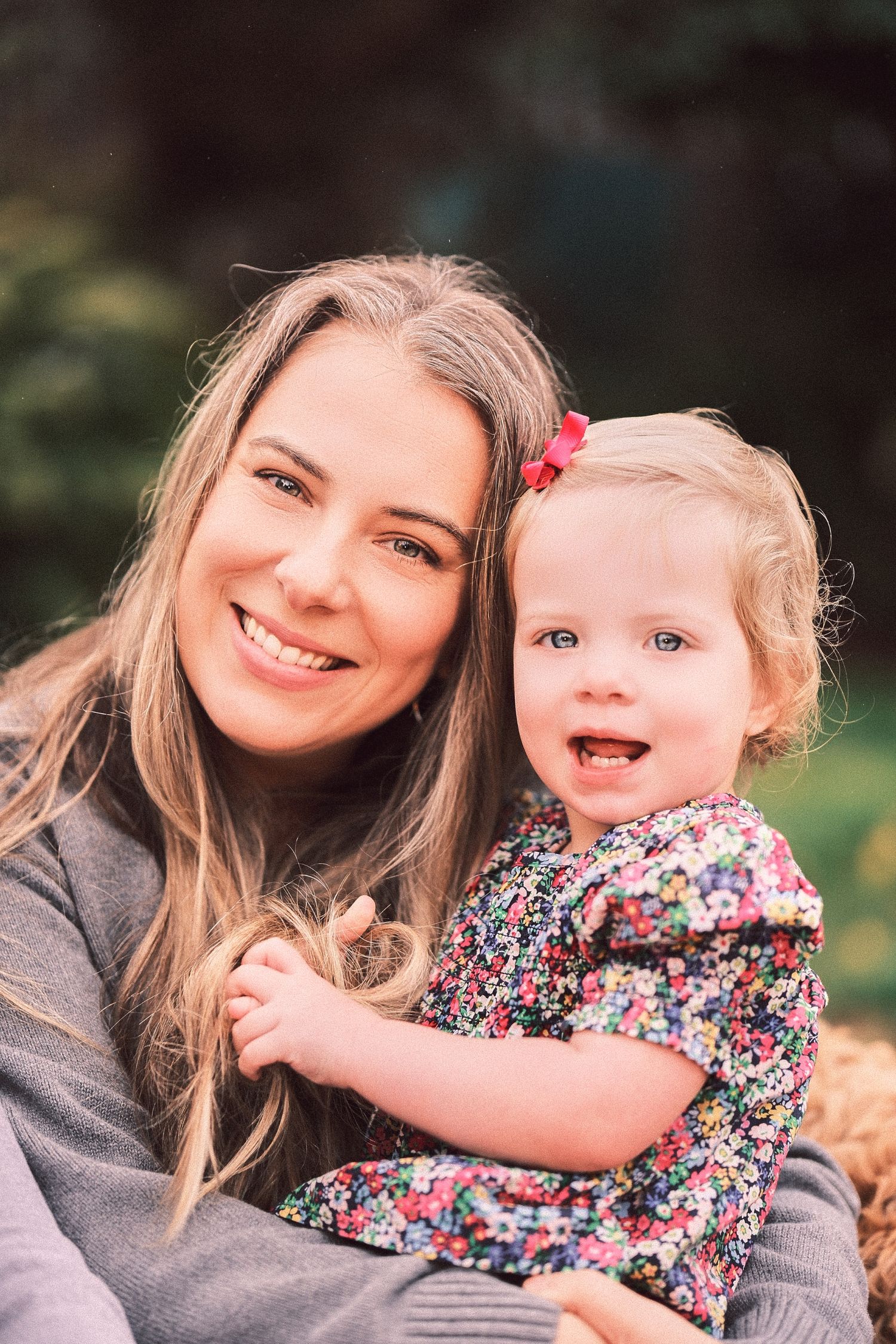 A series of candid outdoor portraits showing joyful moments between parent and child.