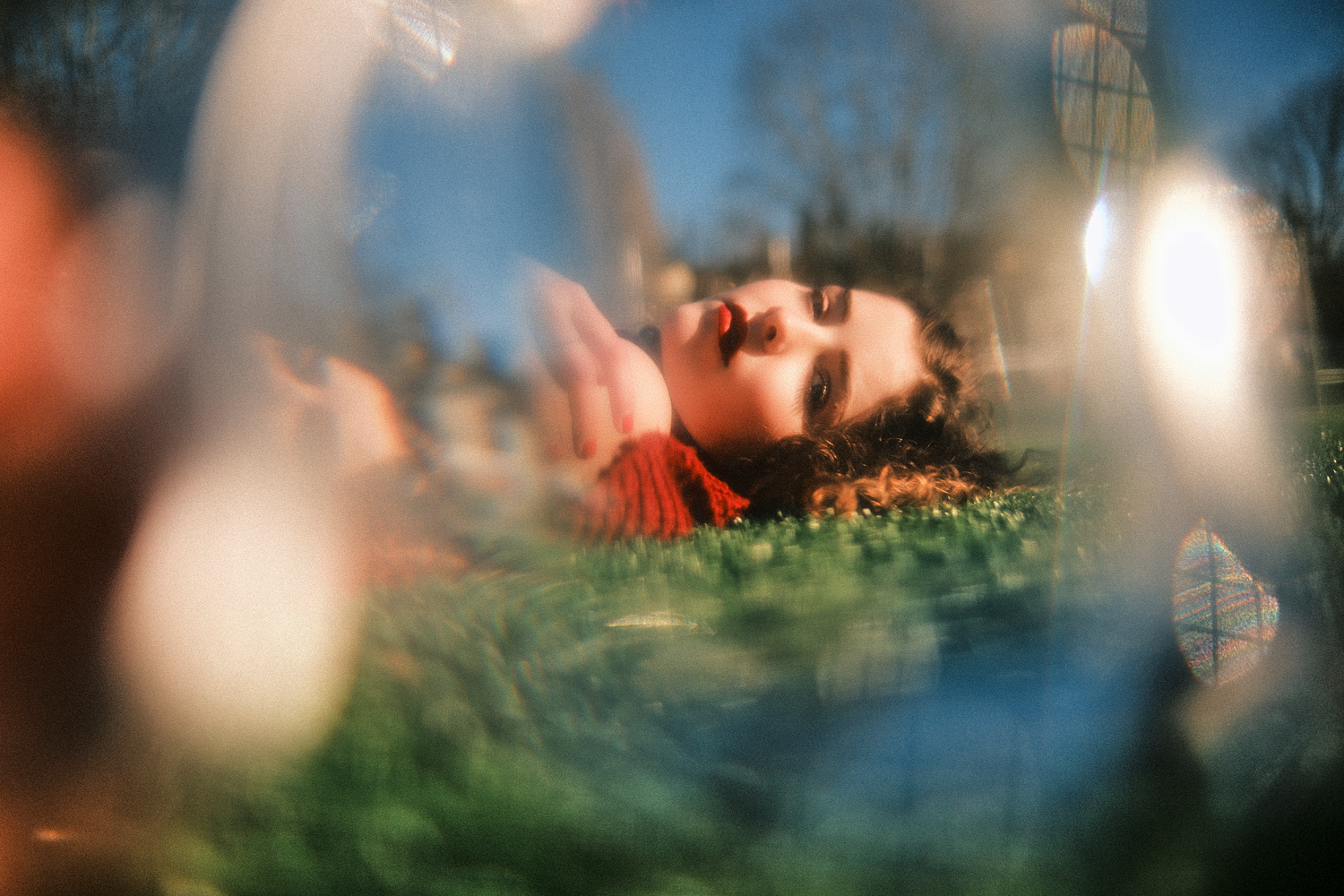 Dreamy bokeh landscape with blurred foreground elements.