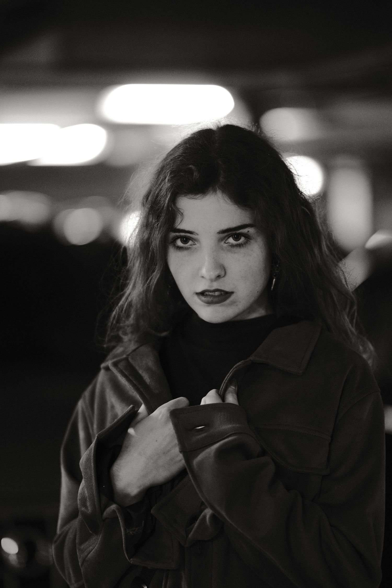 Noir-style black and white portrait sequence with dramatic shadows and lighting.