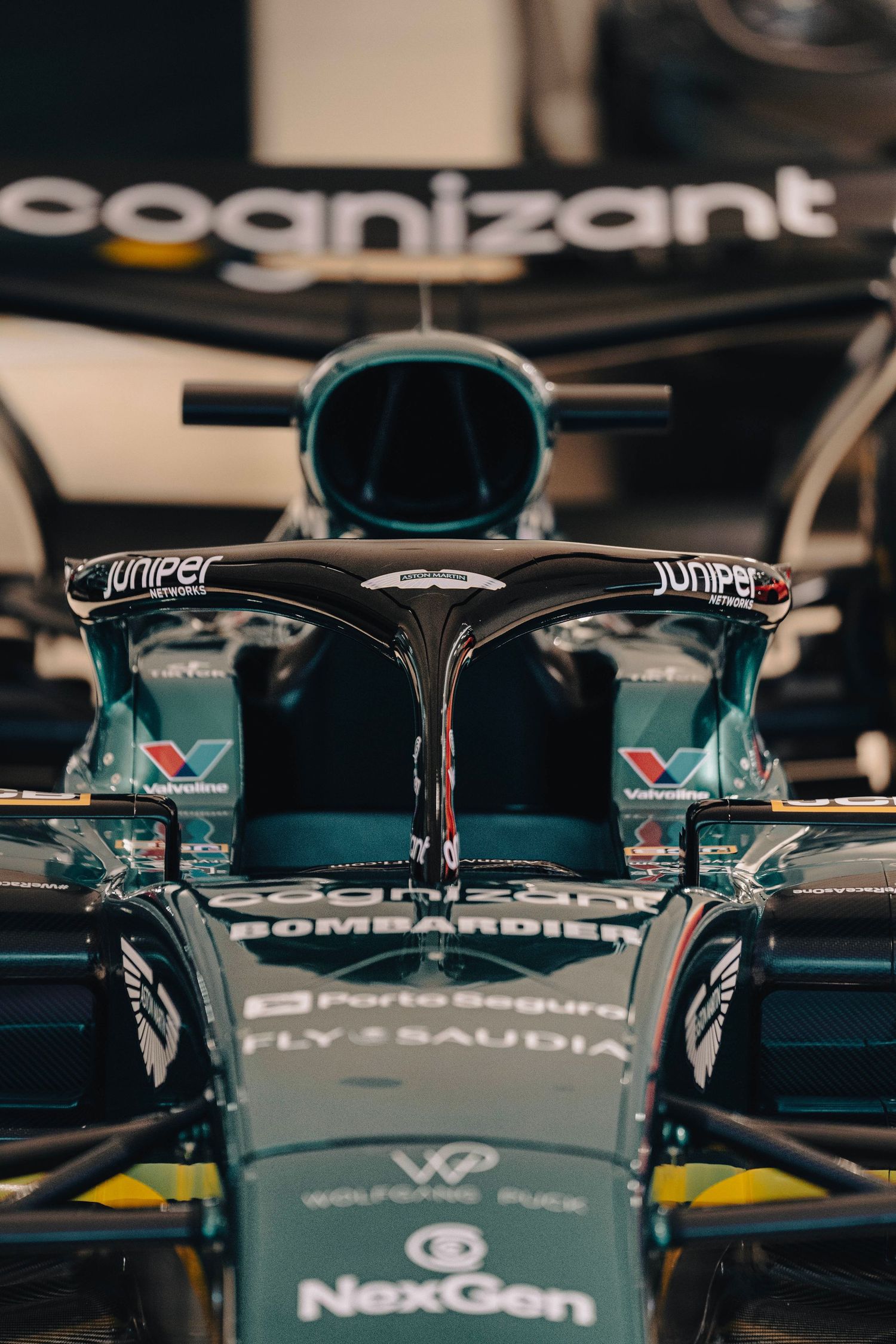 Close-up detail of a Formula 1 Aston Martin AMR23 race car showing the Cognizant sponsorship and halo safety device.
