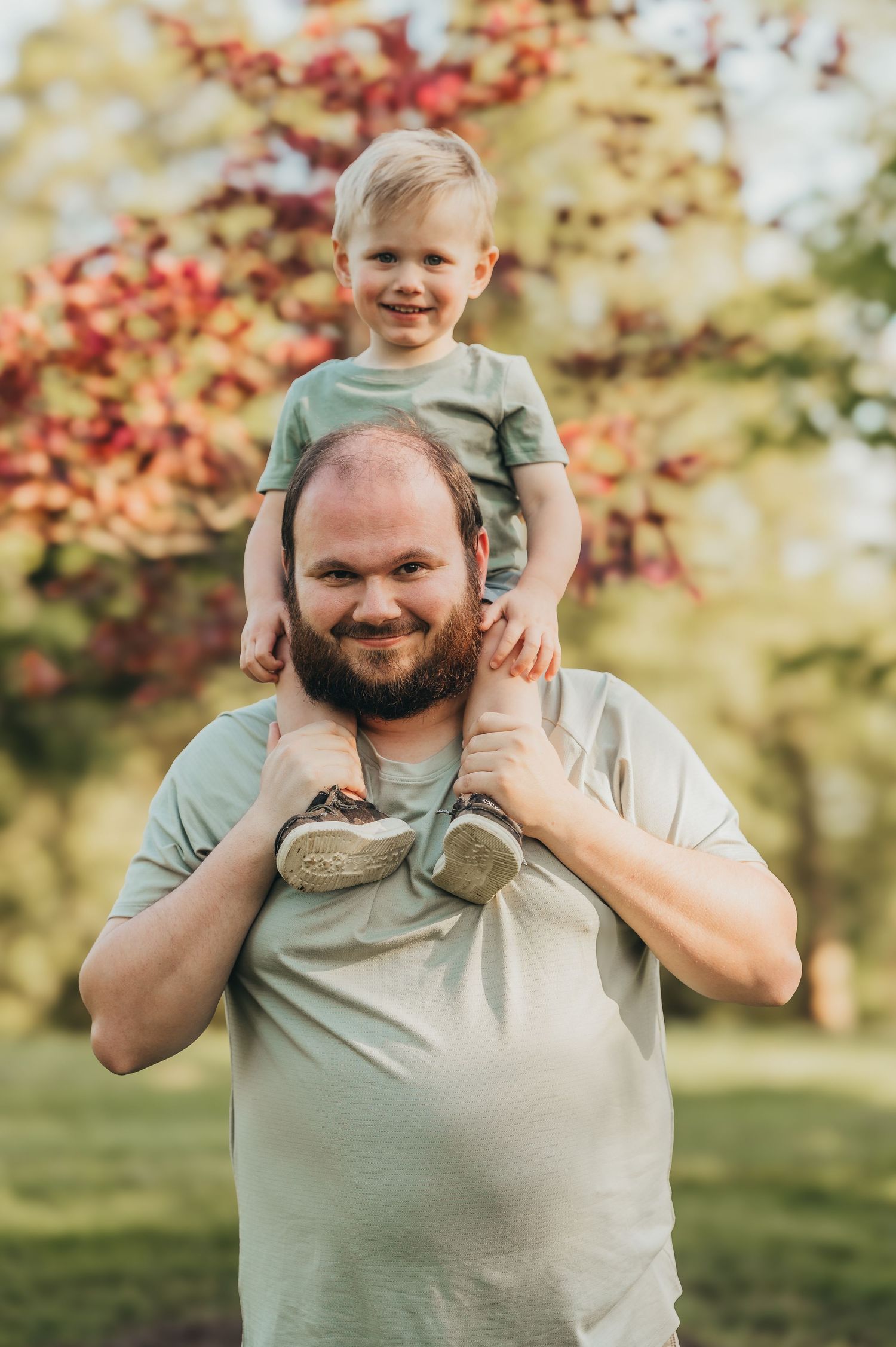 Fairfield Ohio portrait photographer Brett Godfrey of Godfrey Photography posing for an outdoor photo with his son.