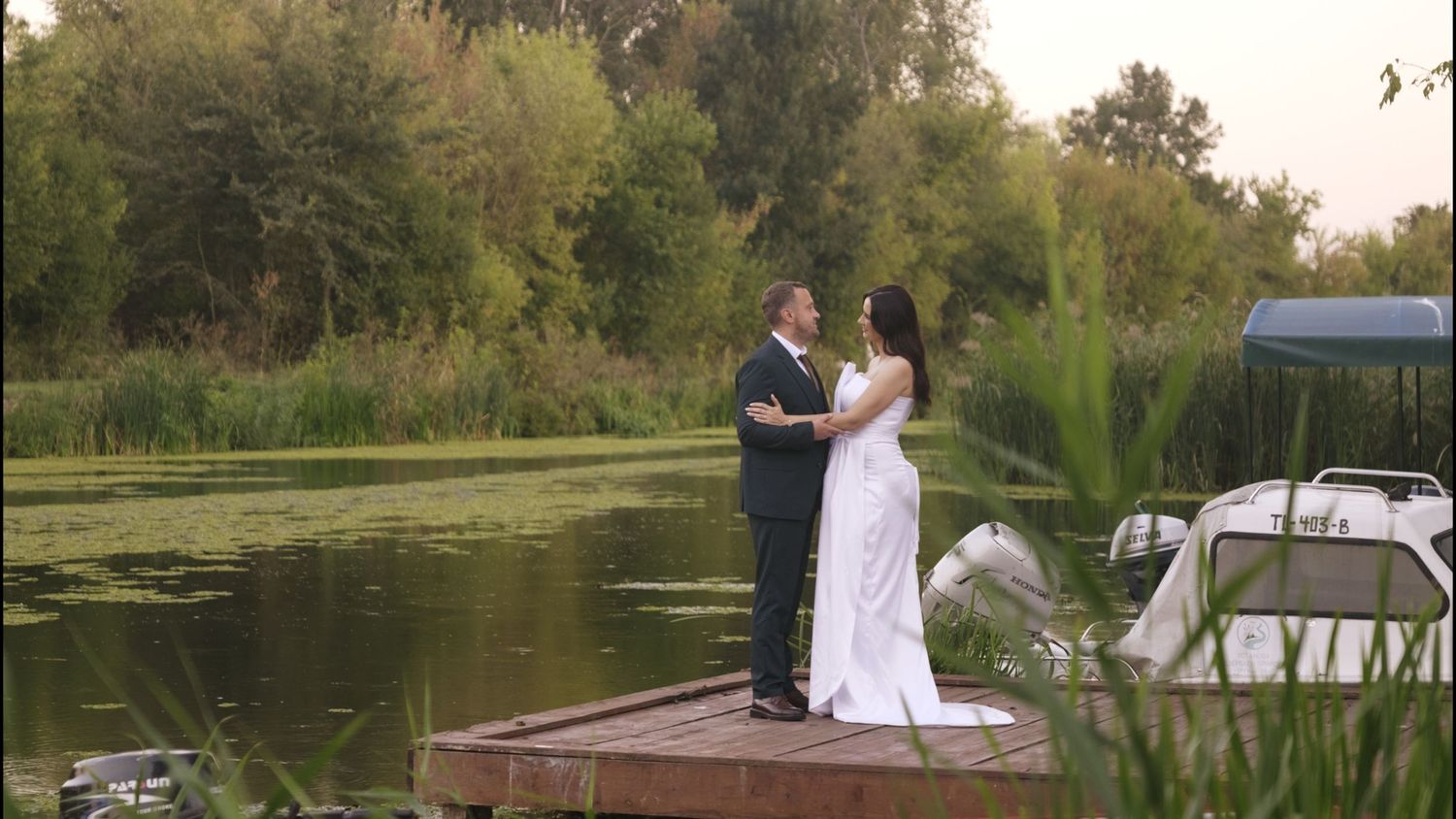 Lakeside wedding venue with water views and natural landscape at sunset.